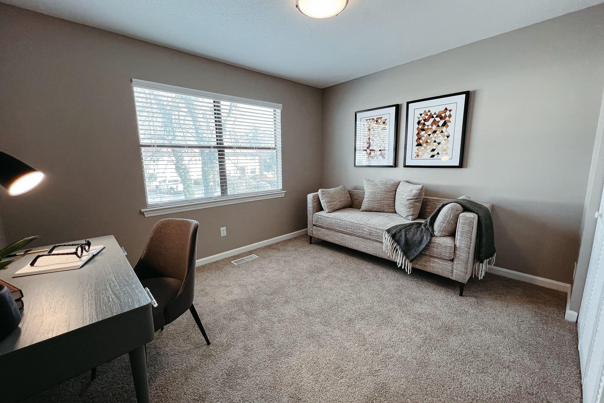 a bedroom with a view of a living room