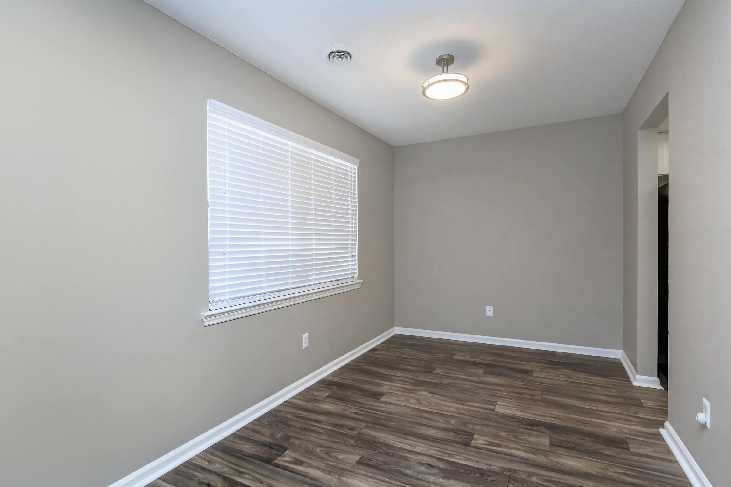 A Separate Room with Hardwood Floors in The Magnolia at Laurel Ridge Apartments