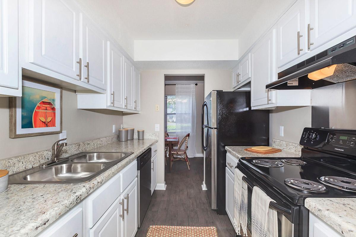 a modern kitchen with stainless steel appliances