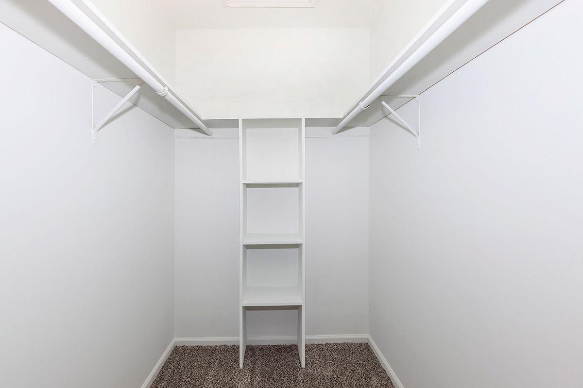 A Large Walk-In Closet with Shelves