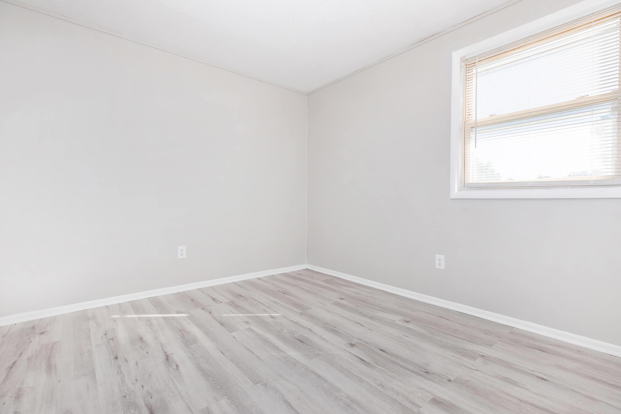 a bedroom with a large window