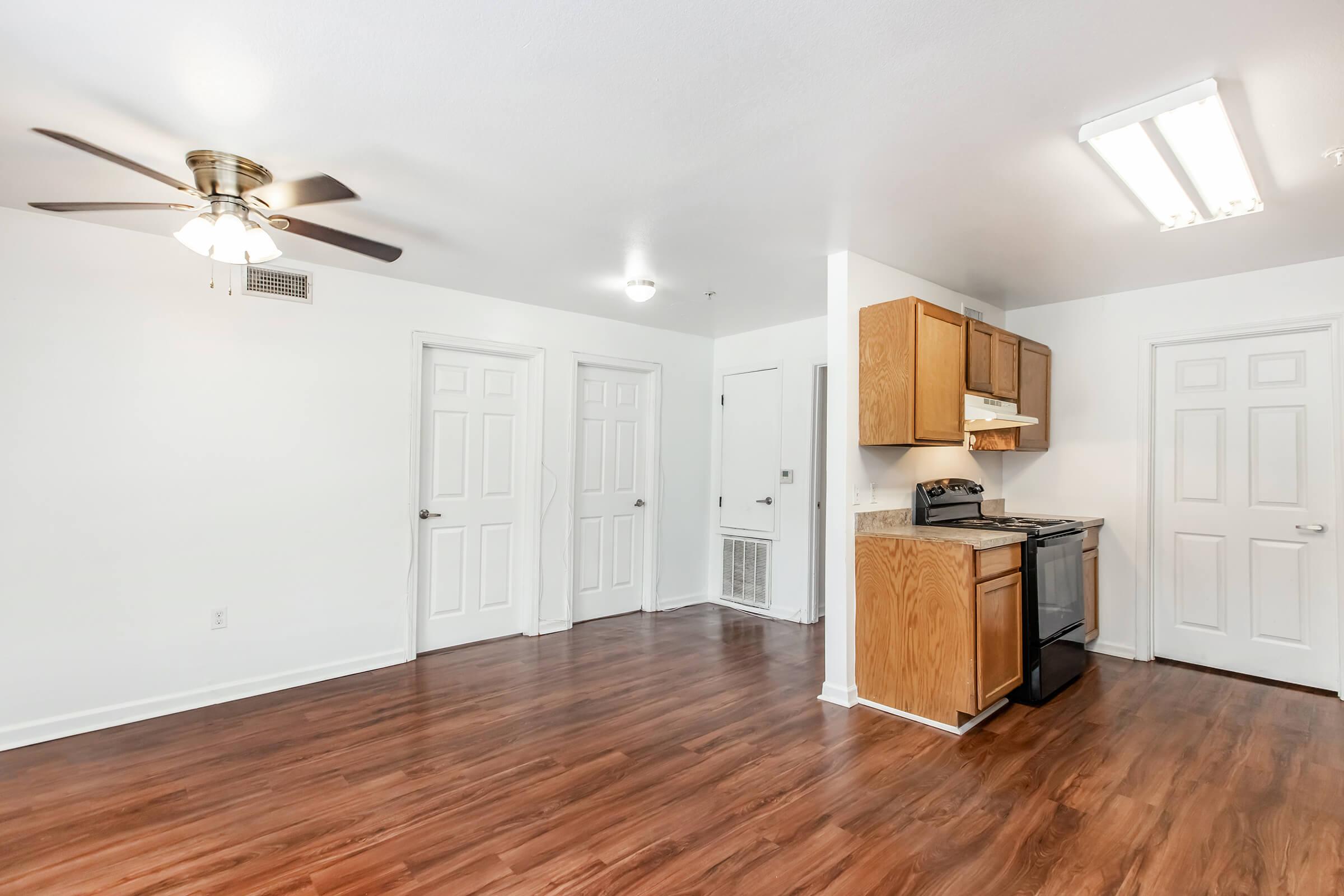 a kitchen with a hard wood floor