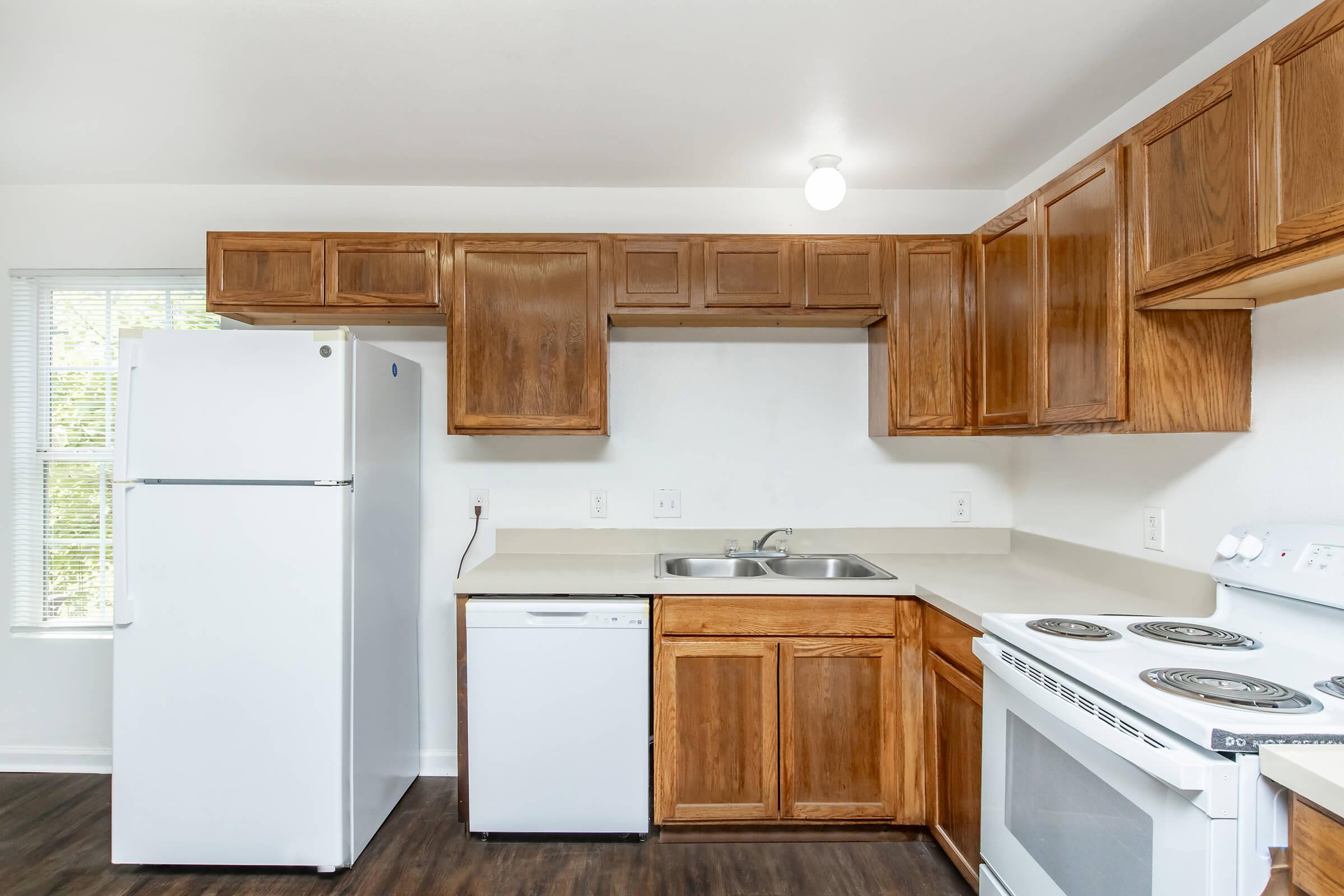 a kitchen with a refrigerator stove and microwave