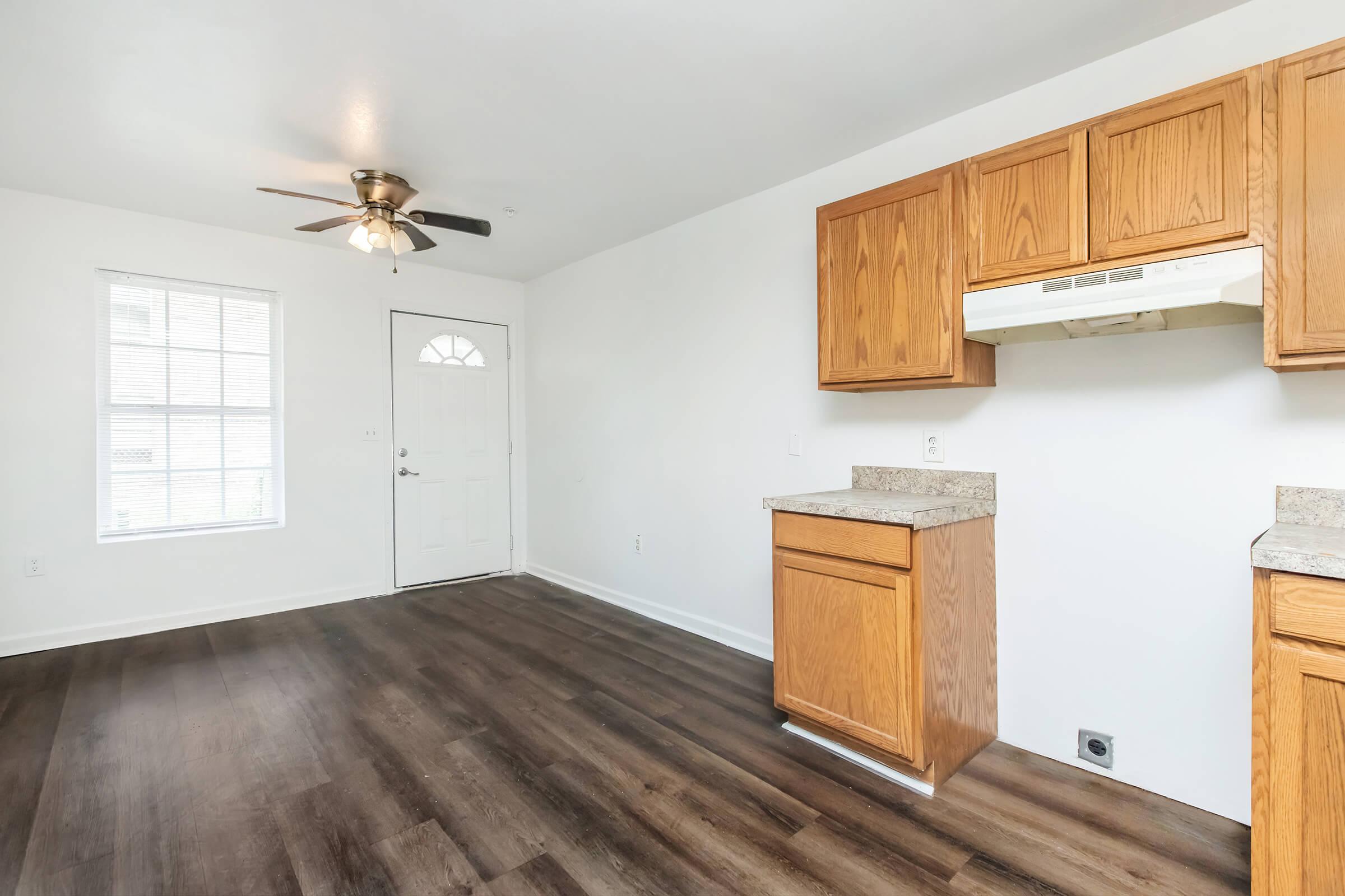 a kitchen with a wood floor