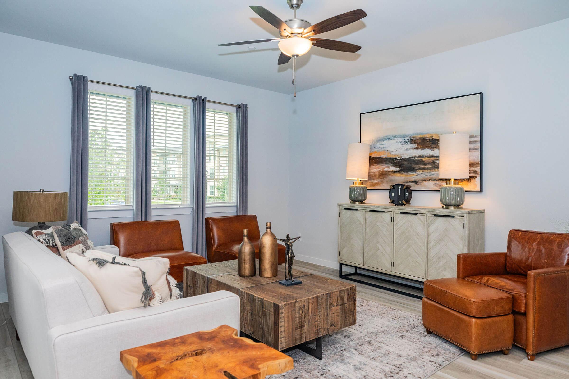 a living room filled with furniture and a flat screen tv