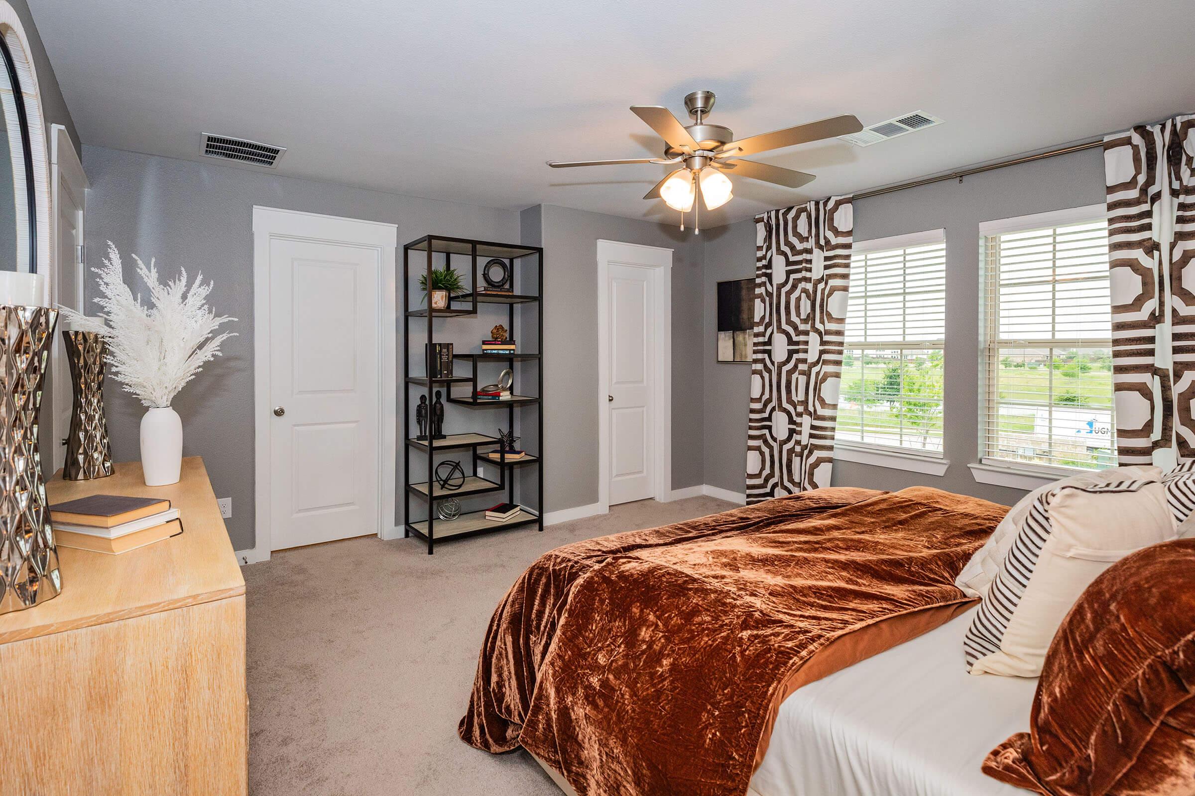 a bedroom with a large bed in a room