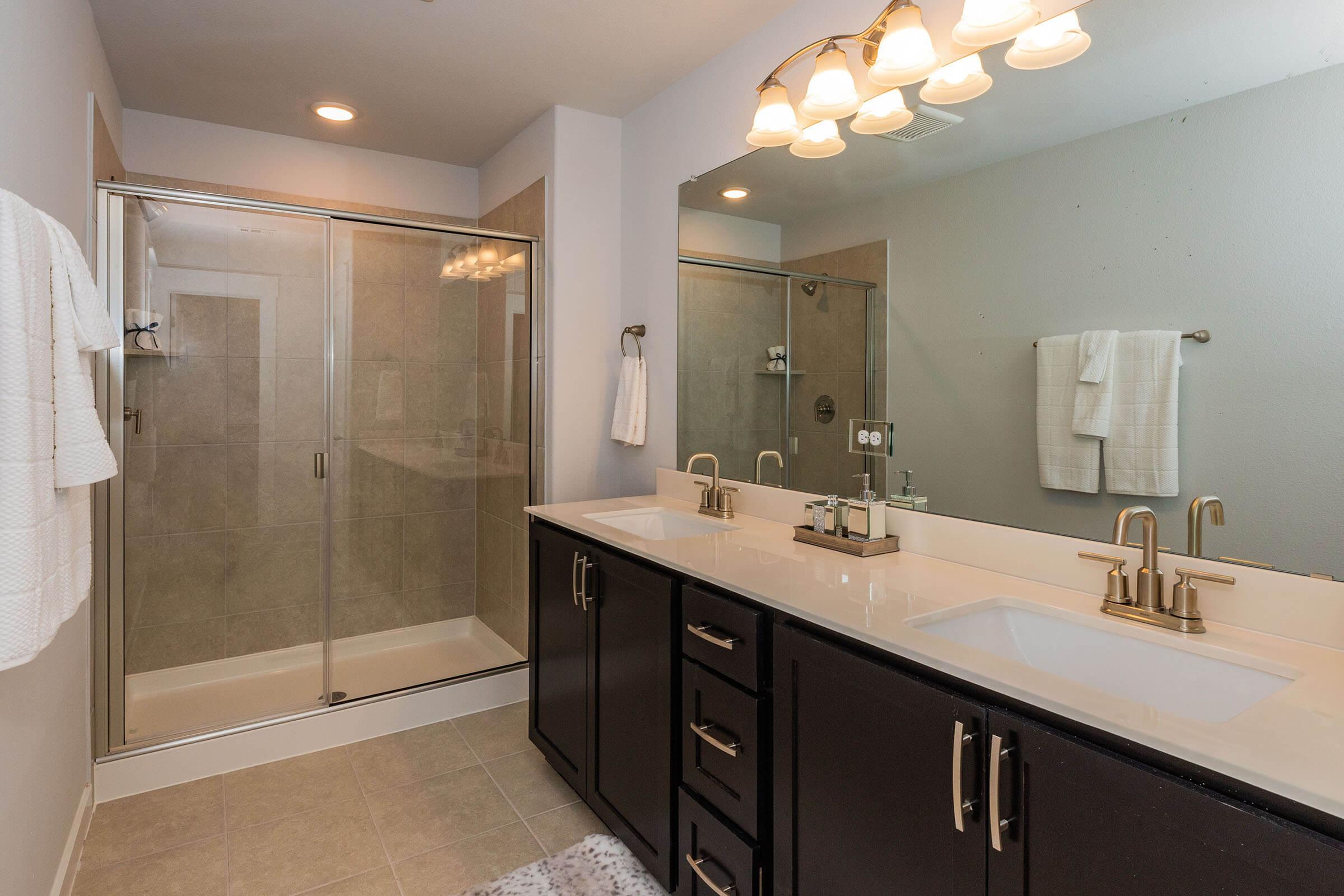 a kitchen with a sink and a mirror