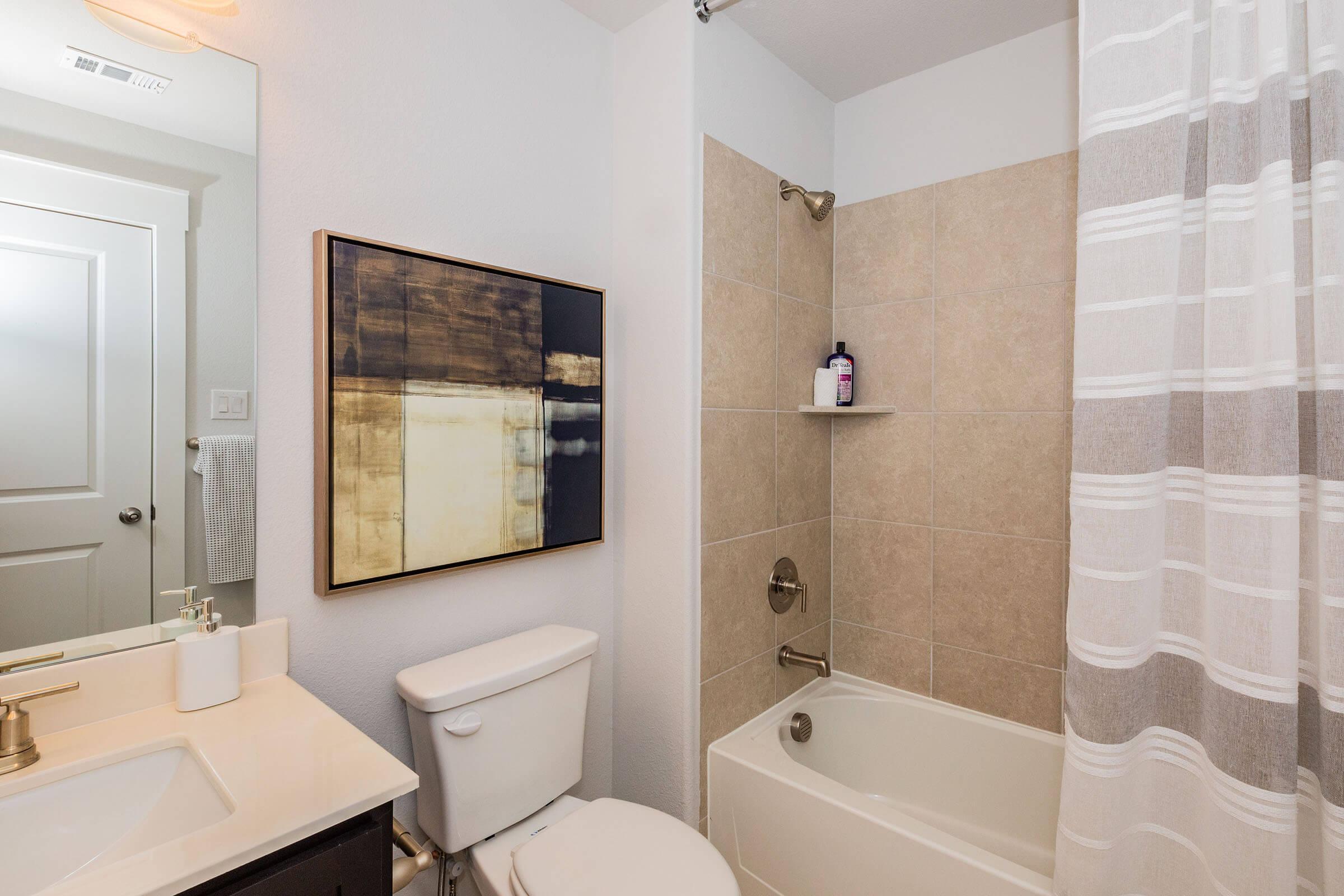 a shower that has a sink and a mirror