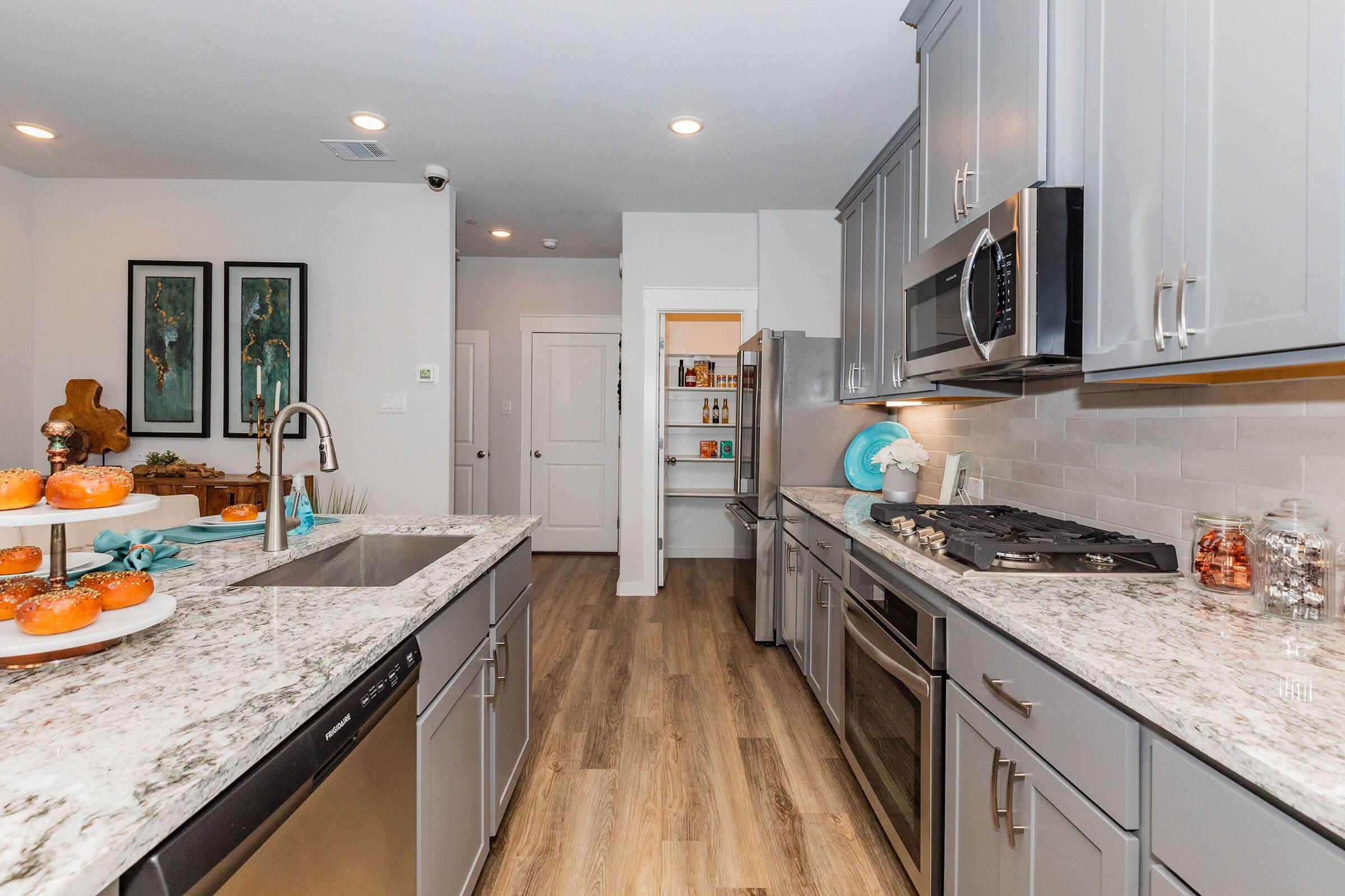 a modern kitchen with stainless steel appliances