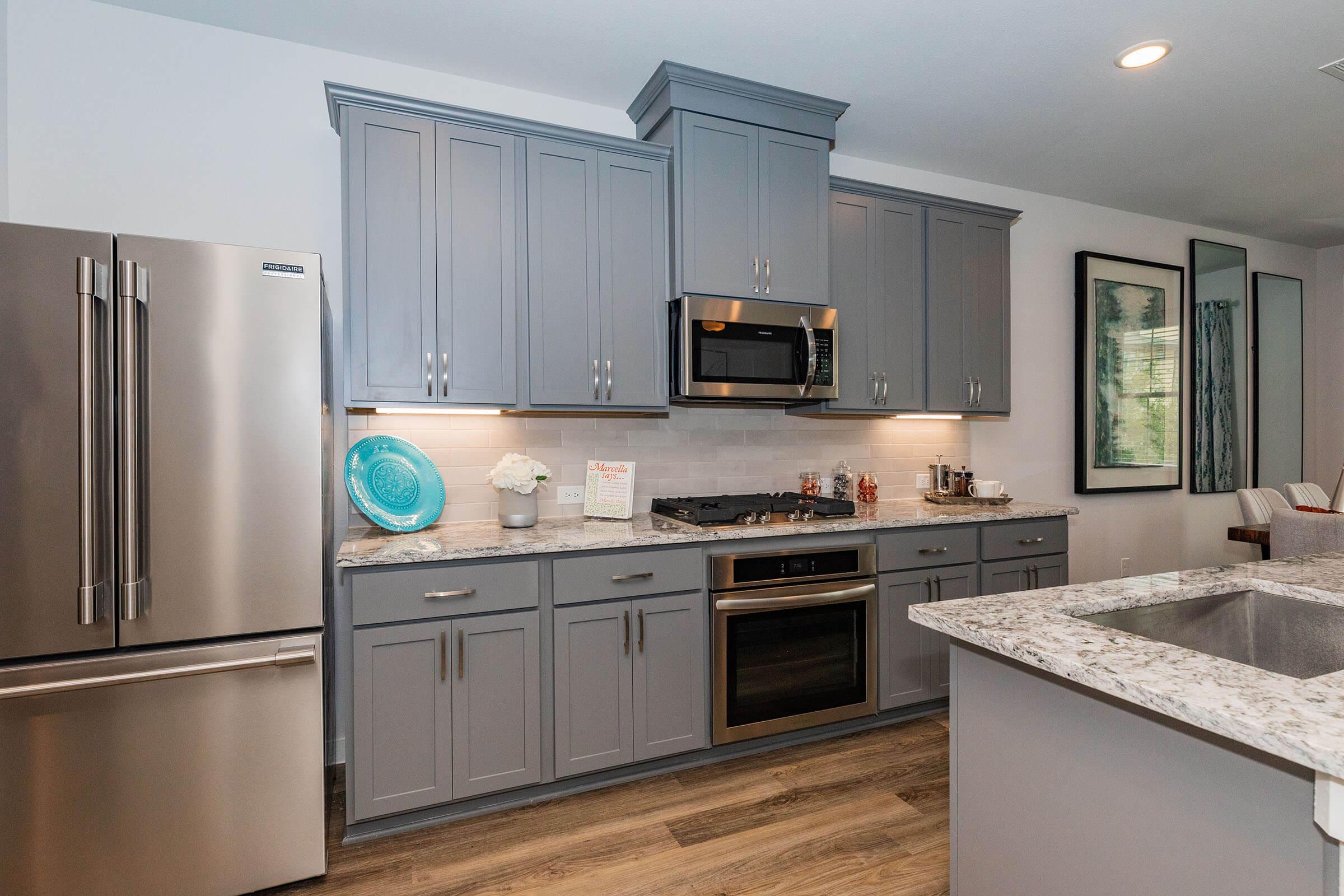 a large kitchen with stainless steel appliances