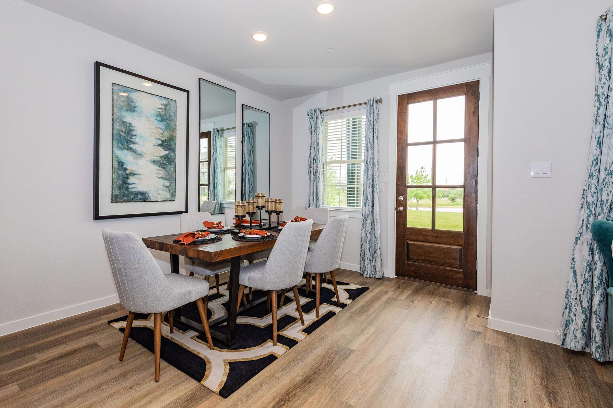 a living room filled with furniture and a large window