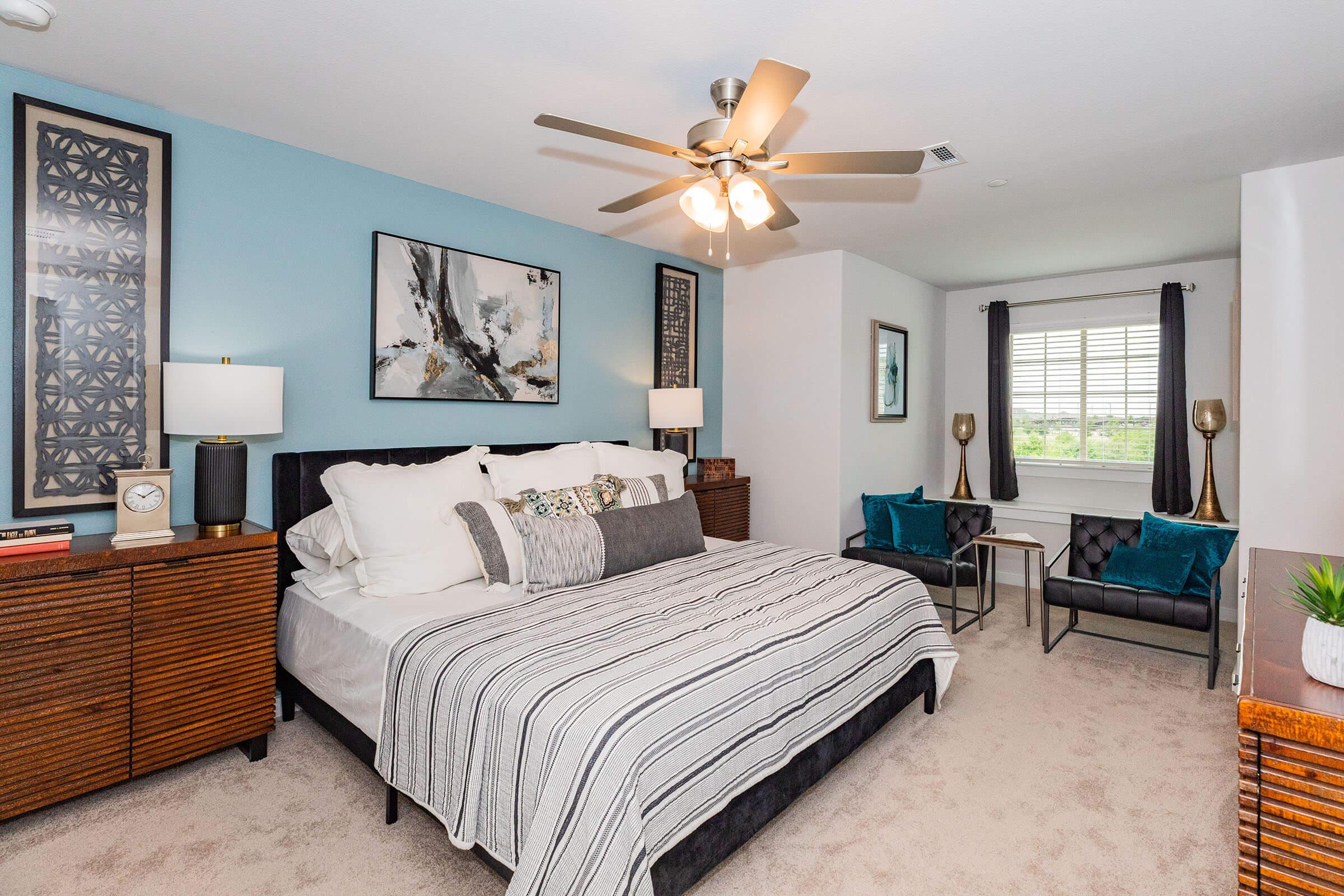 a bedroom with a large bed in a room