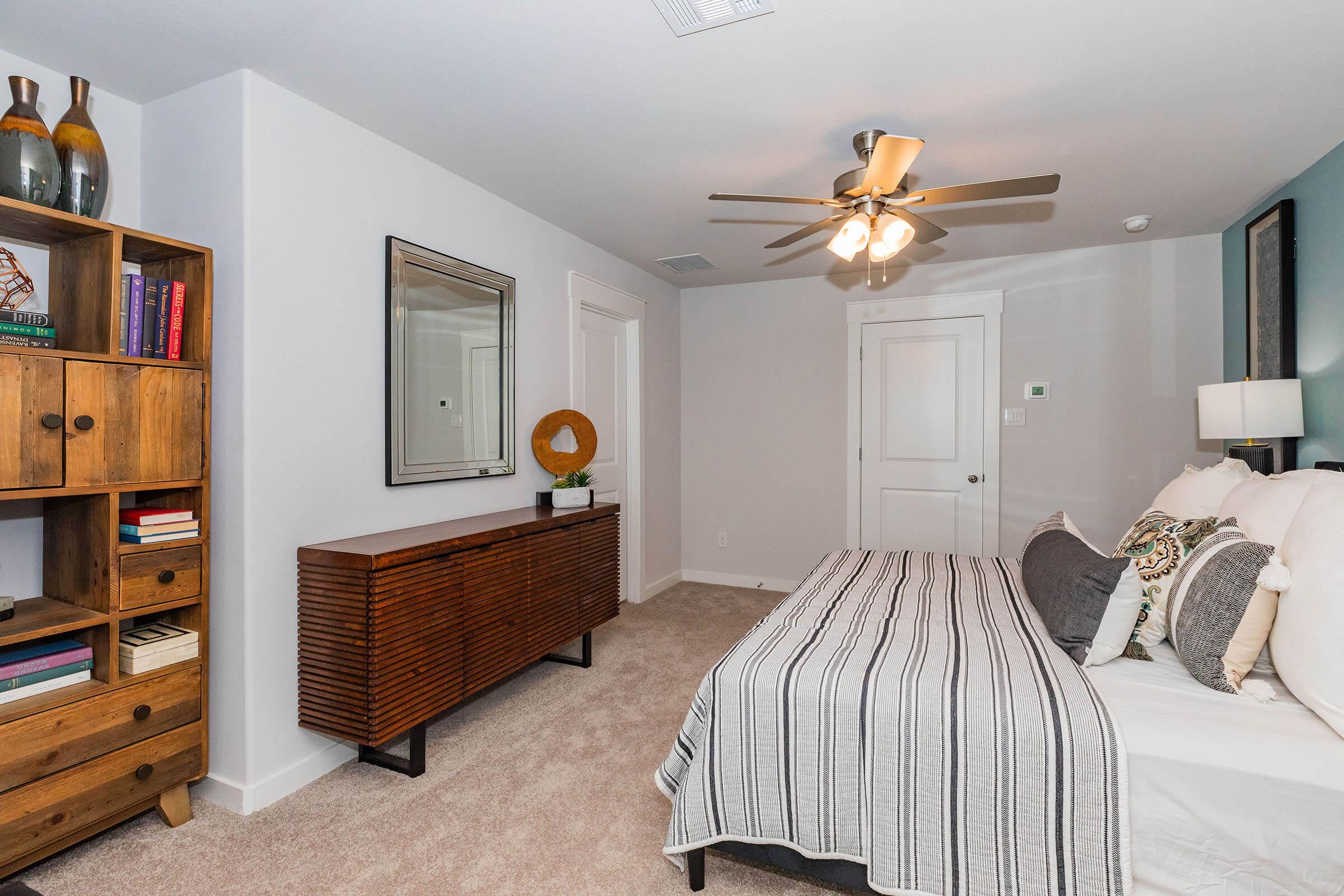 a living room filled with furniture and a flat screen tv