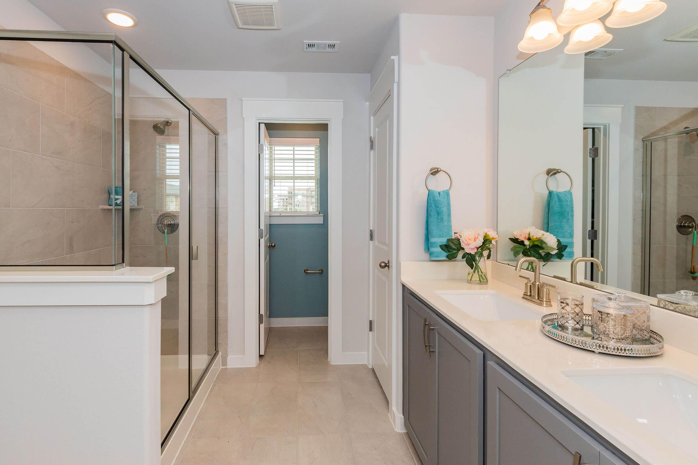 a kitchen with a sink and a mirror