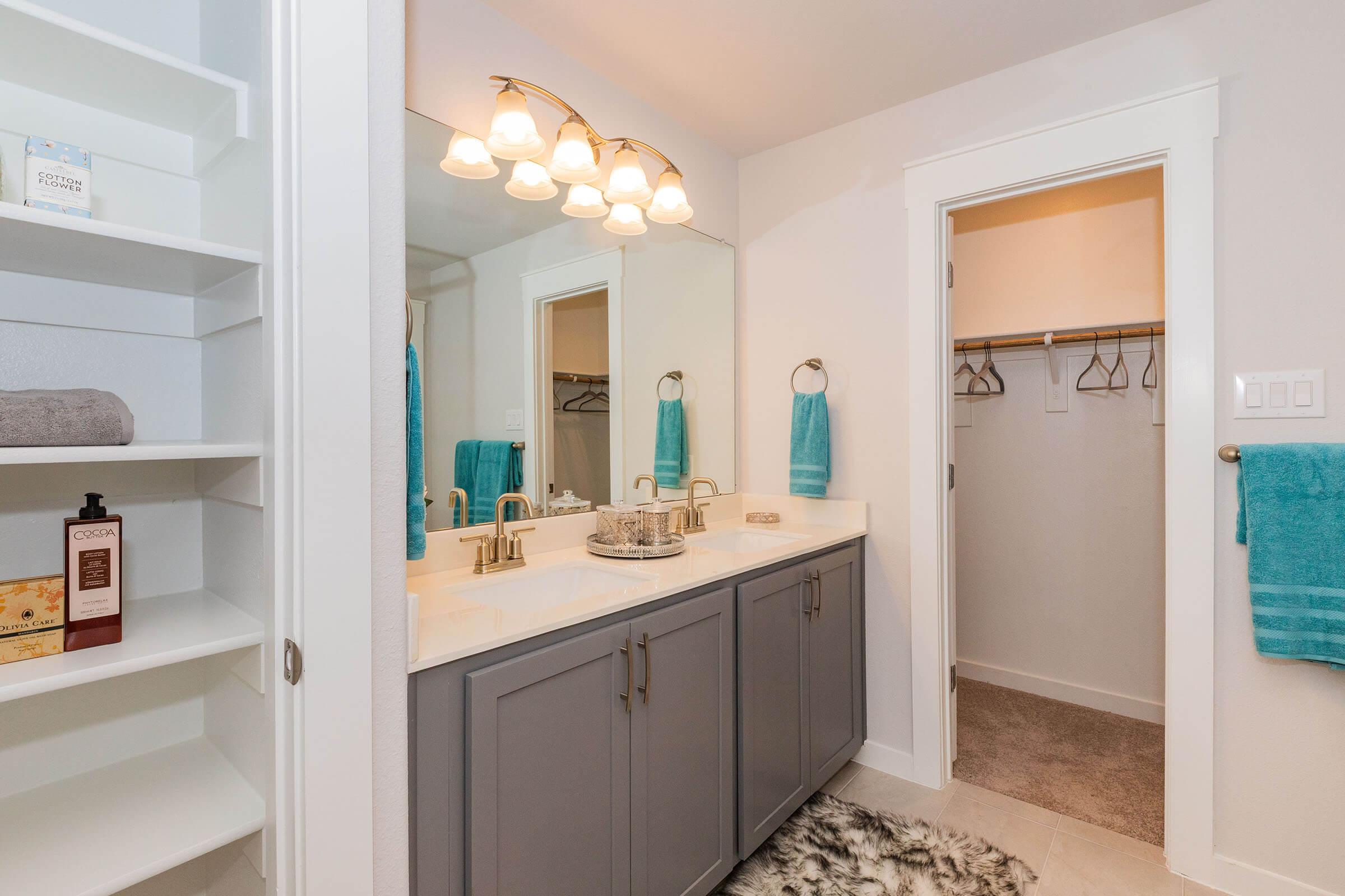 a kitchen with a sink and a mirror