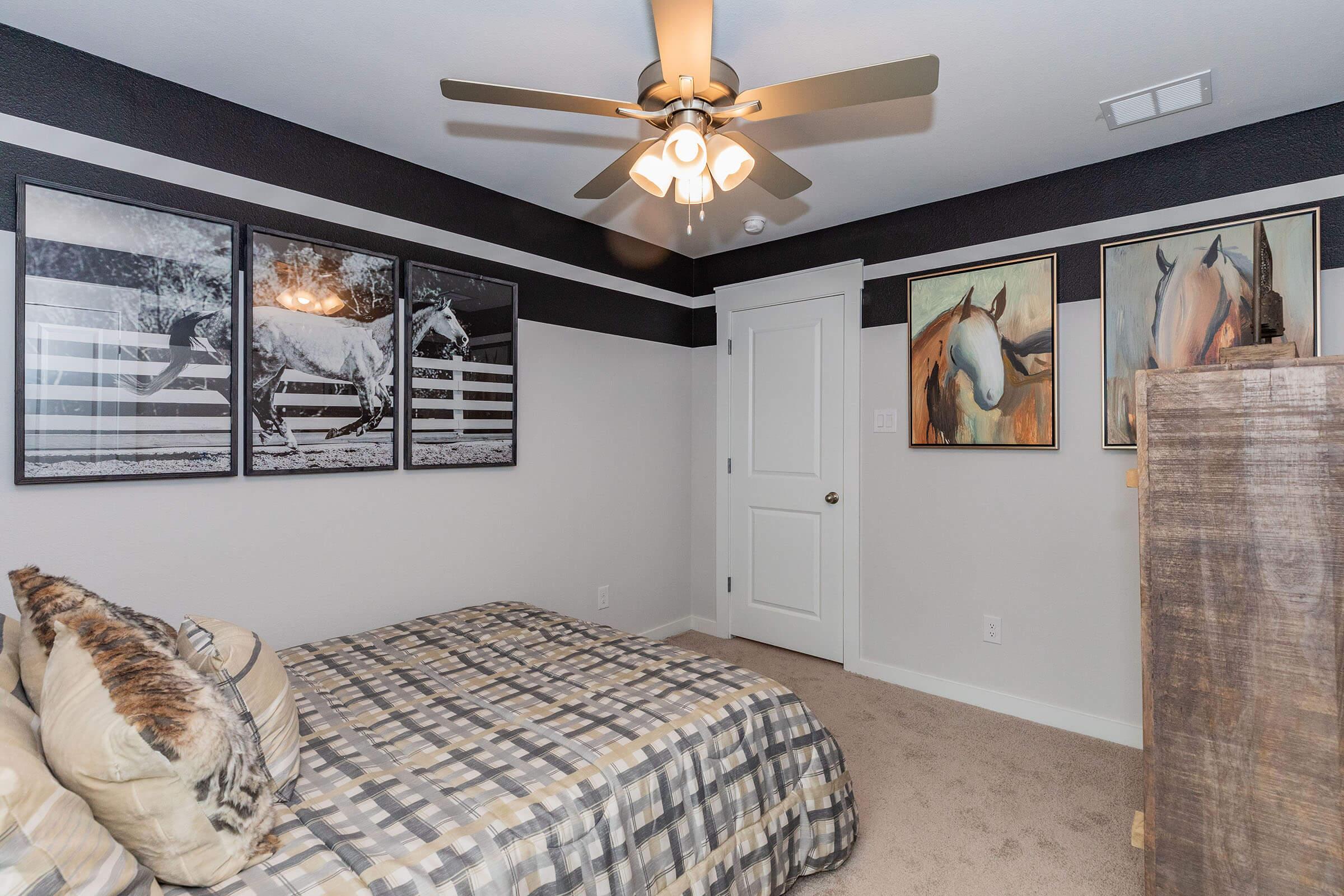 a bedroom with a dog on a bed