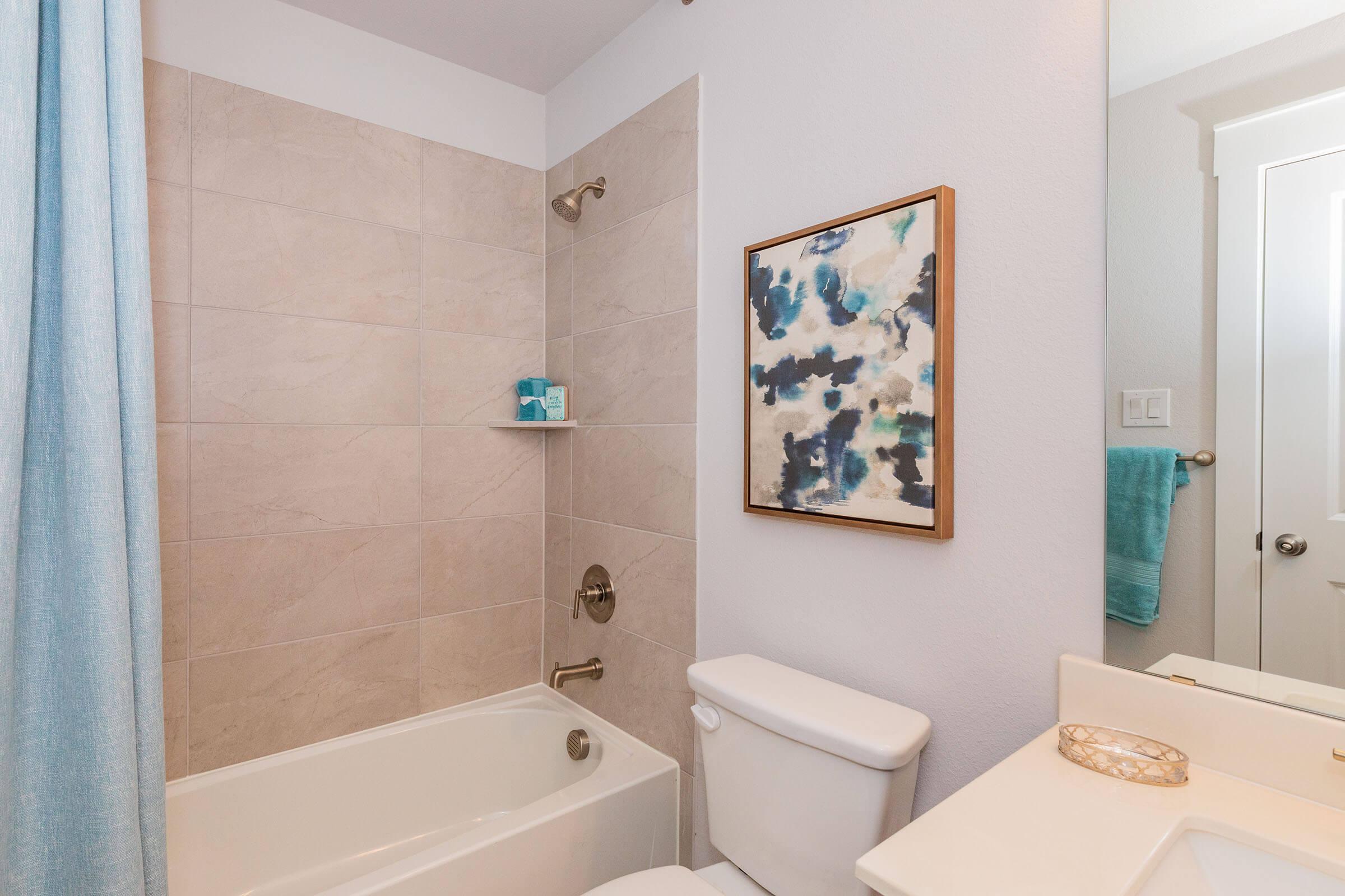 a shower that has a sink and a mirror