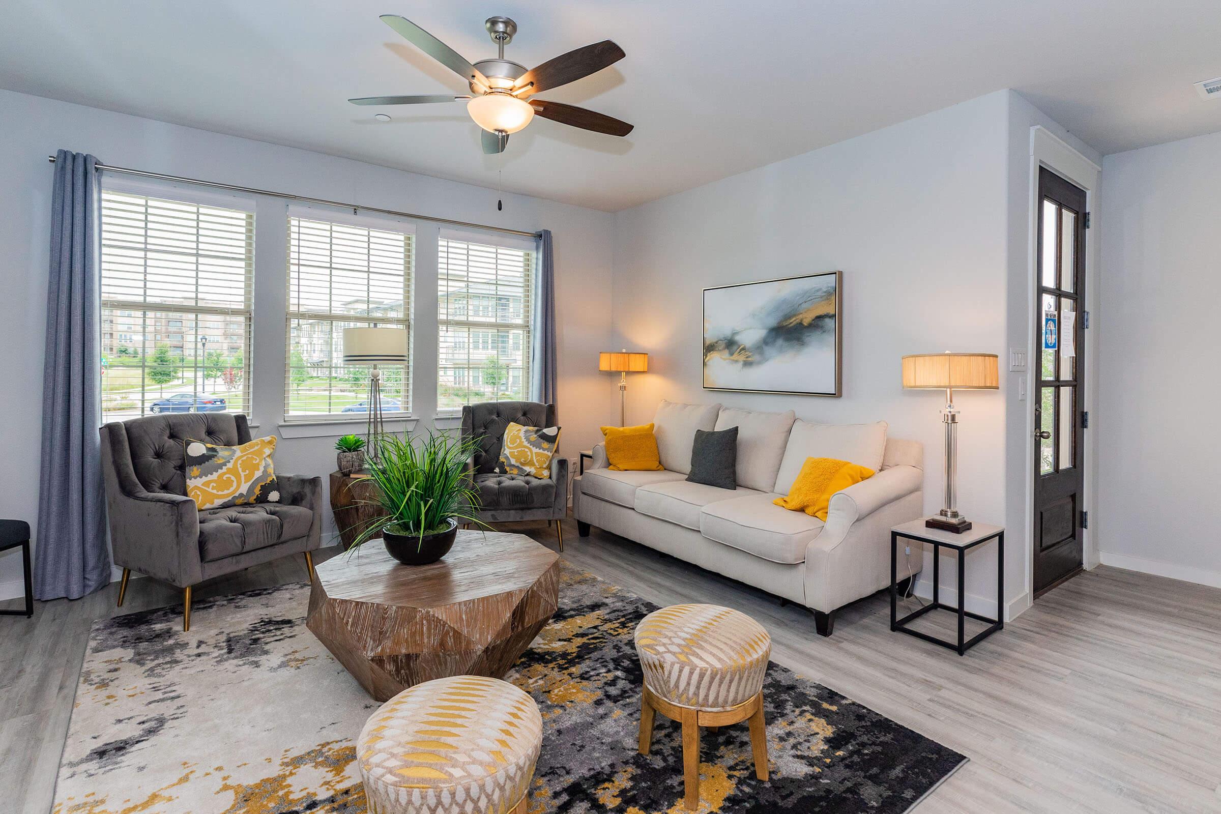 a living room filled with furniture and a fire place