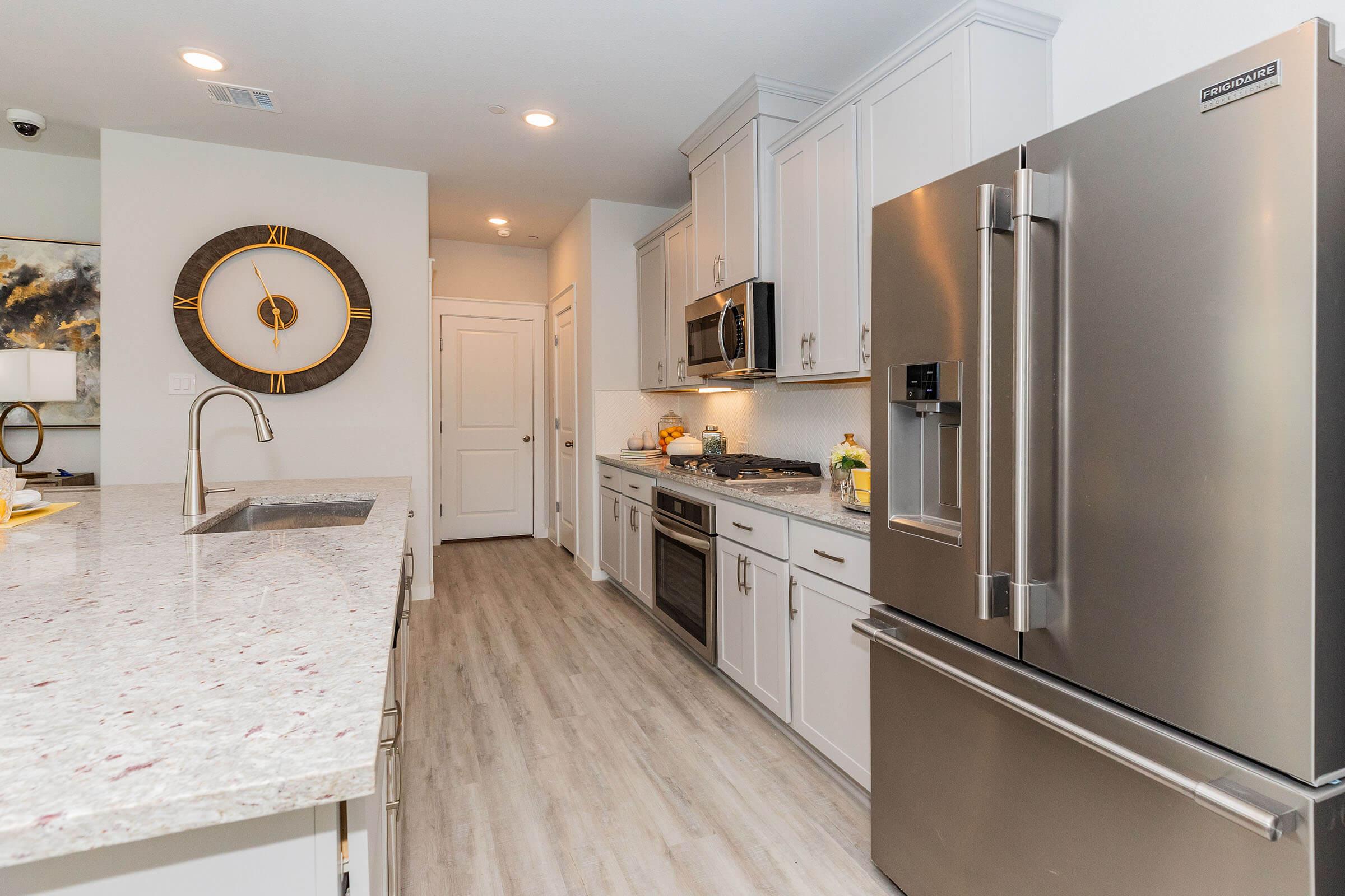 a stainless steel refrigerator in a kitchen