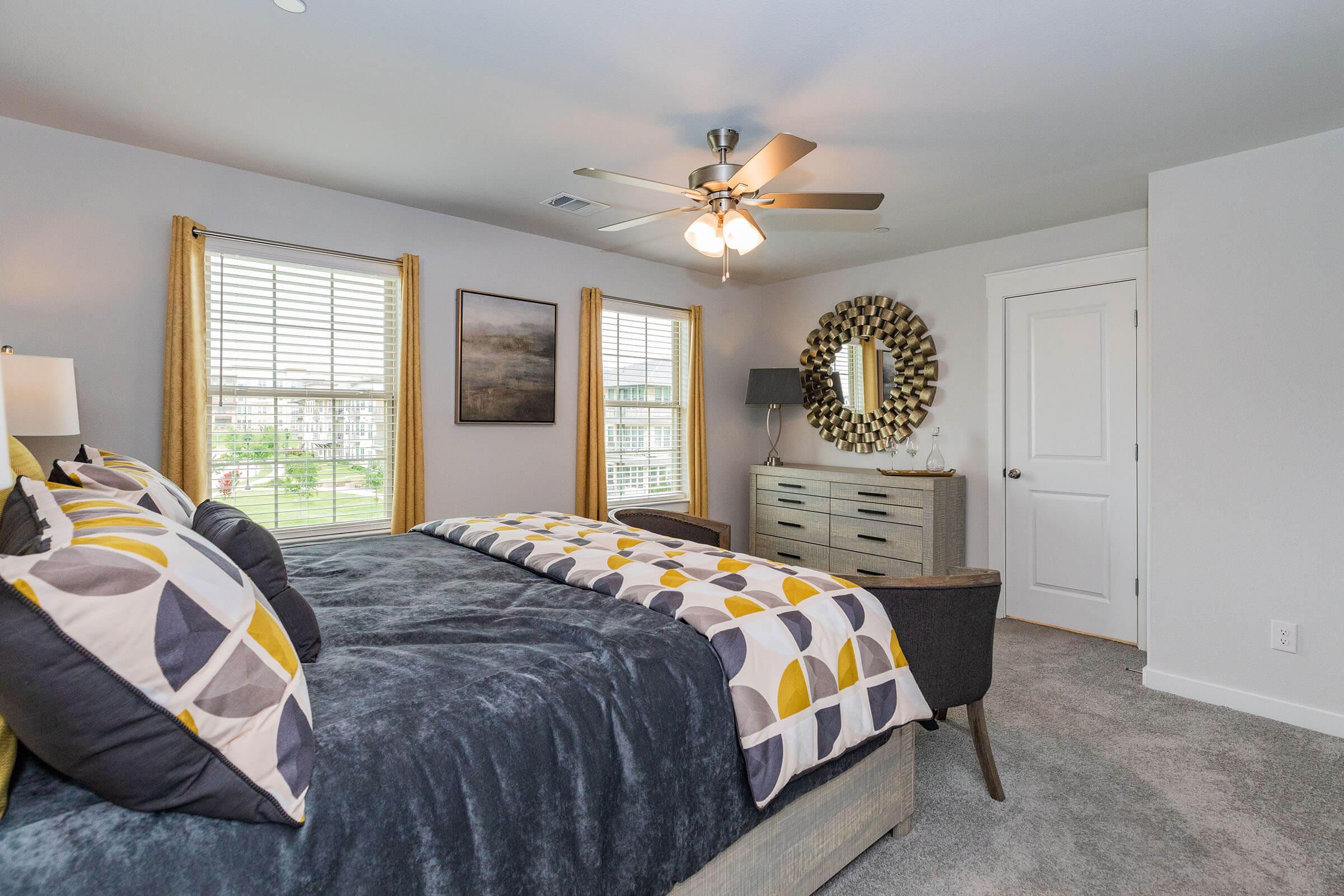 a bedroom with a large bed in a room