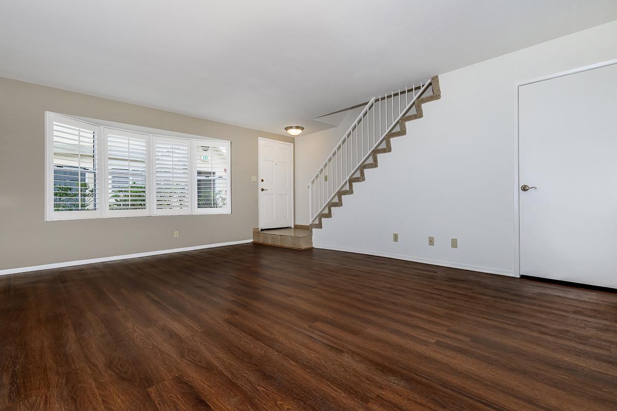 a large white building with a wooden floor