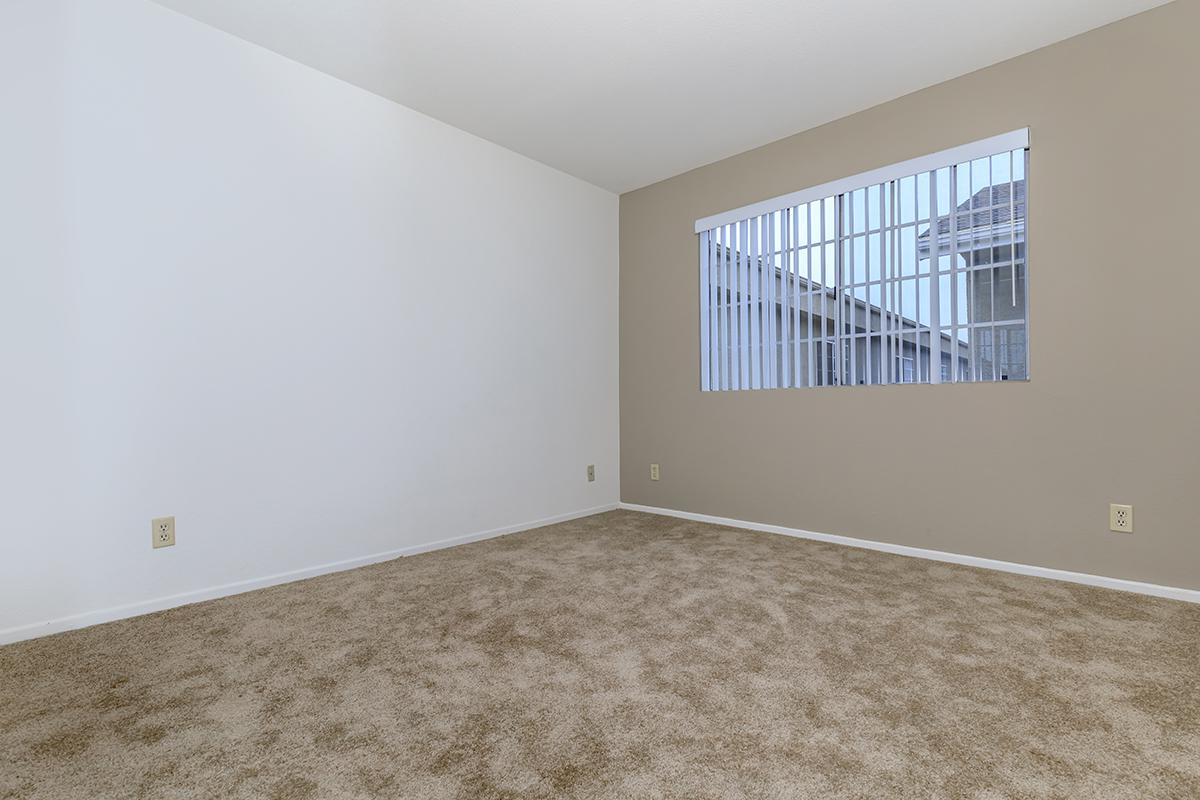 a bedroom with a bed in a room