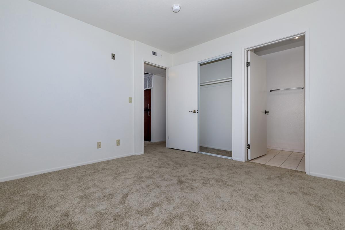 a bedroom with a bed in a room