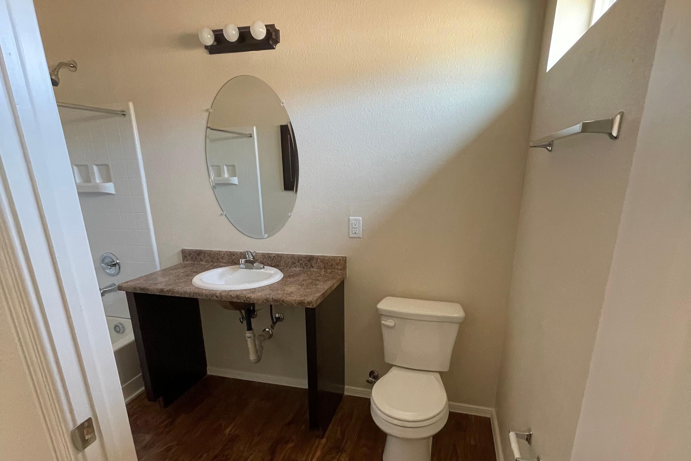 a restroom with a sink and a mirror