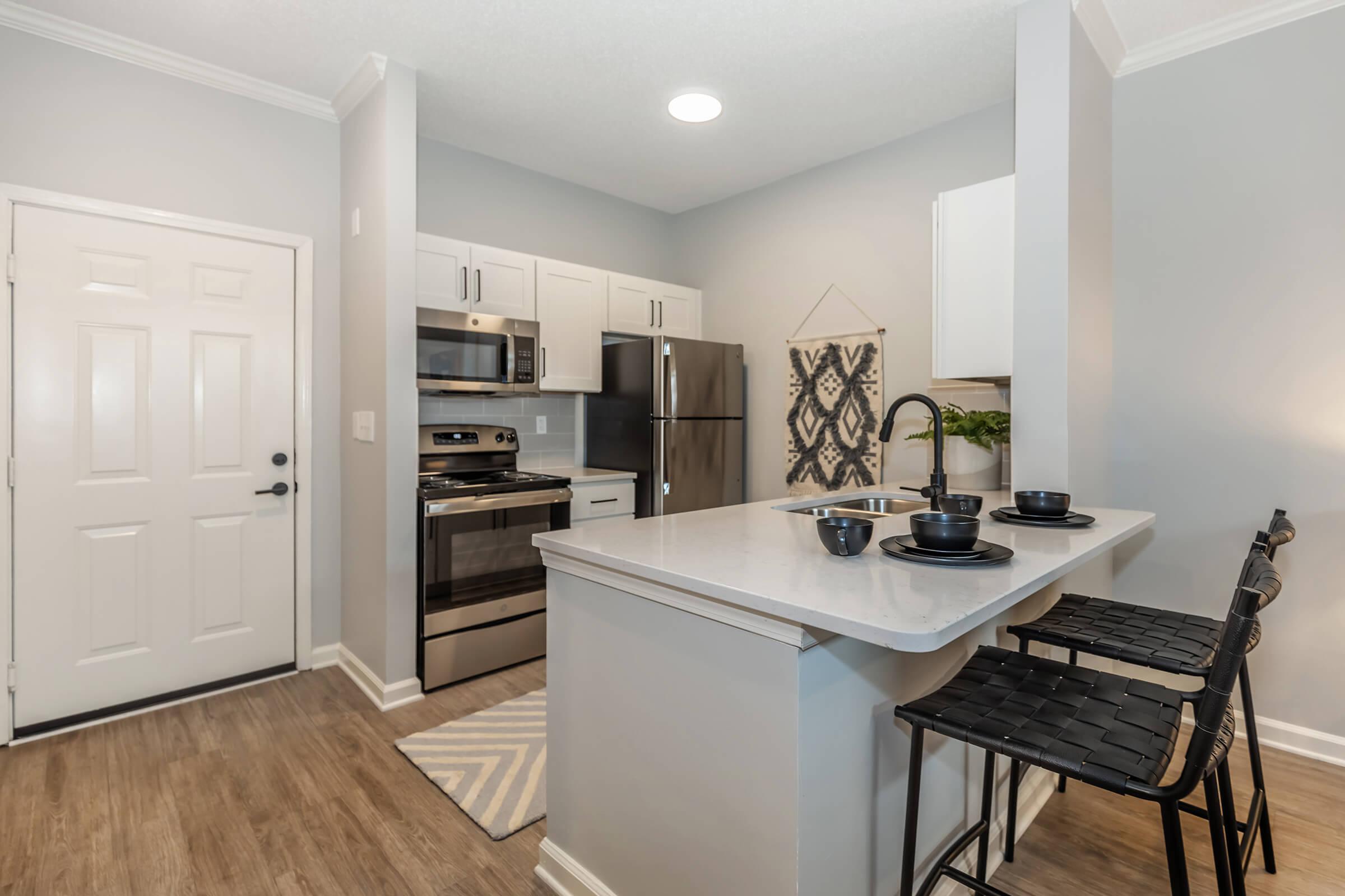 a kitchen with a dining room table