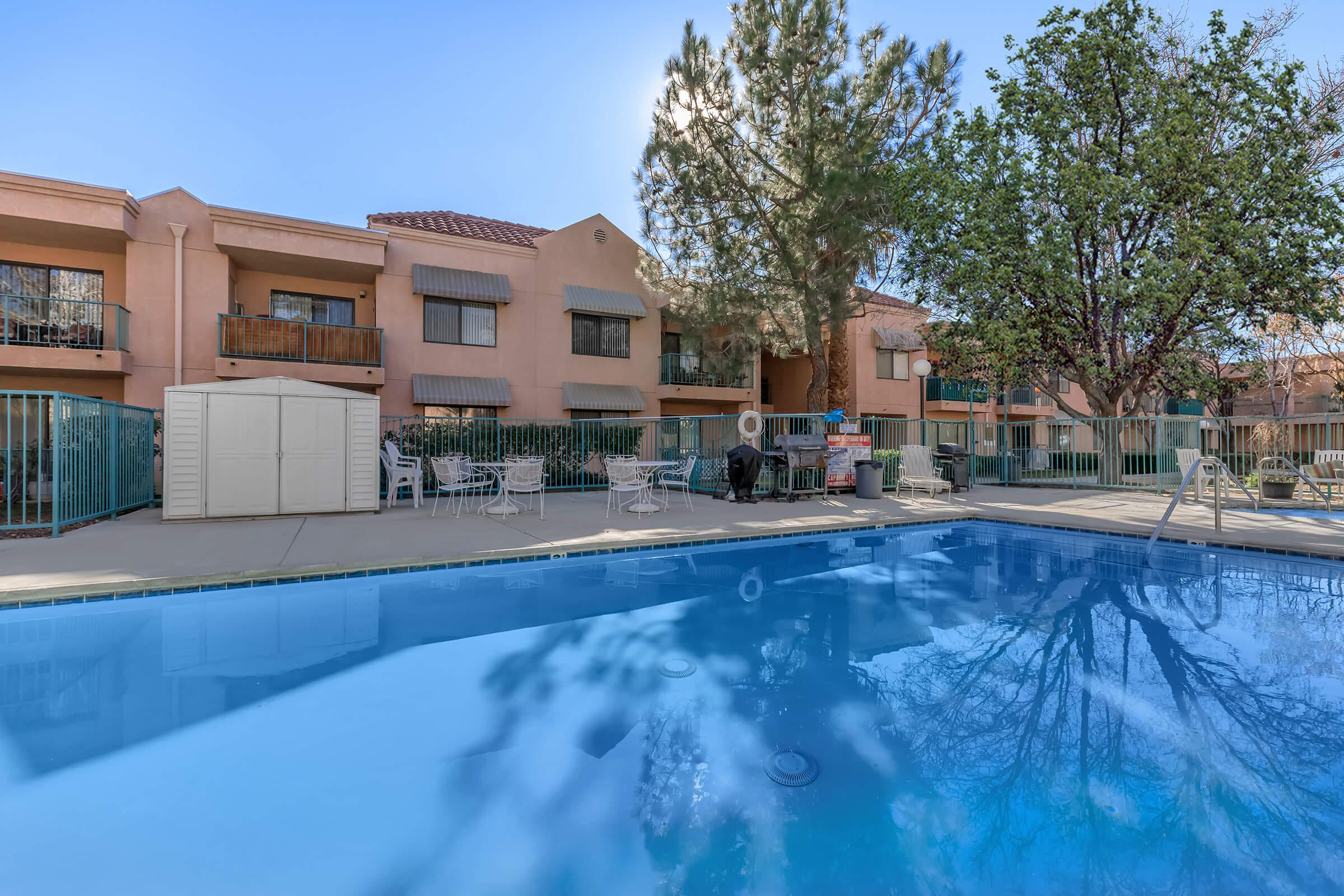 The community pool with green trees