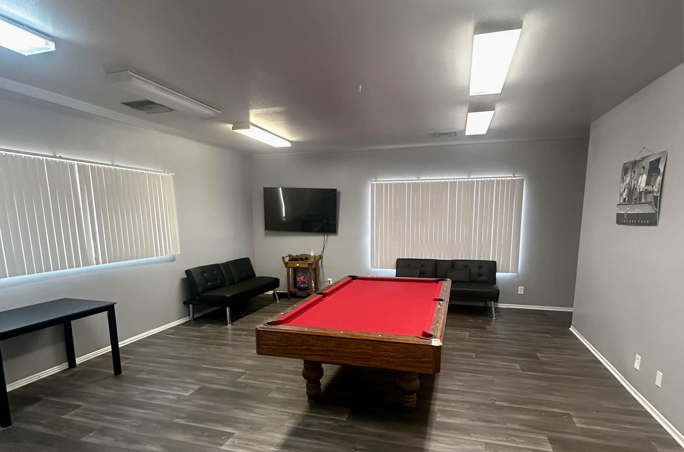 Cedar Town Square common area with pool table and seating area