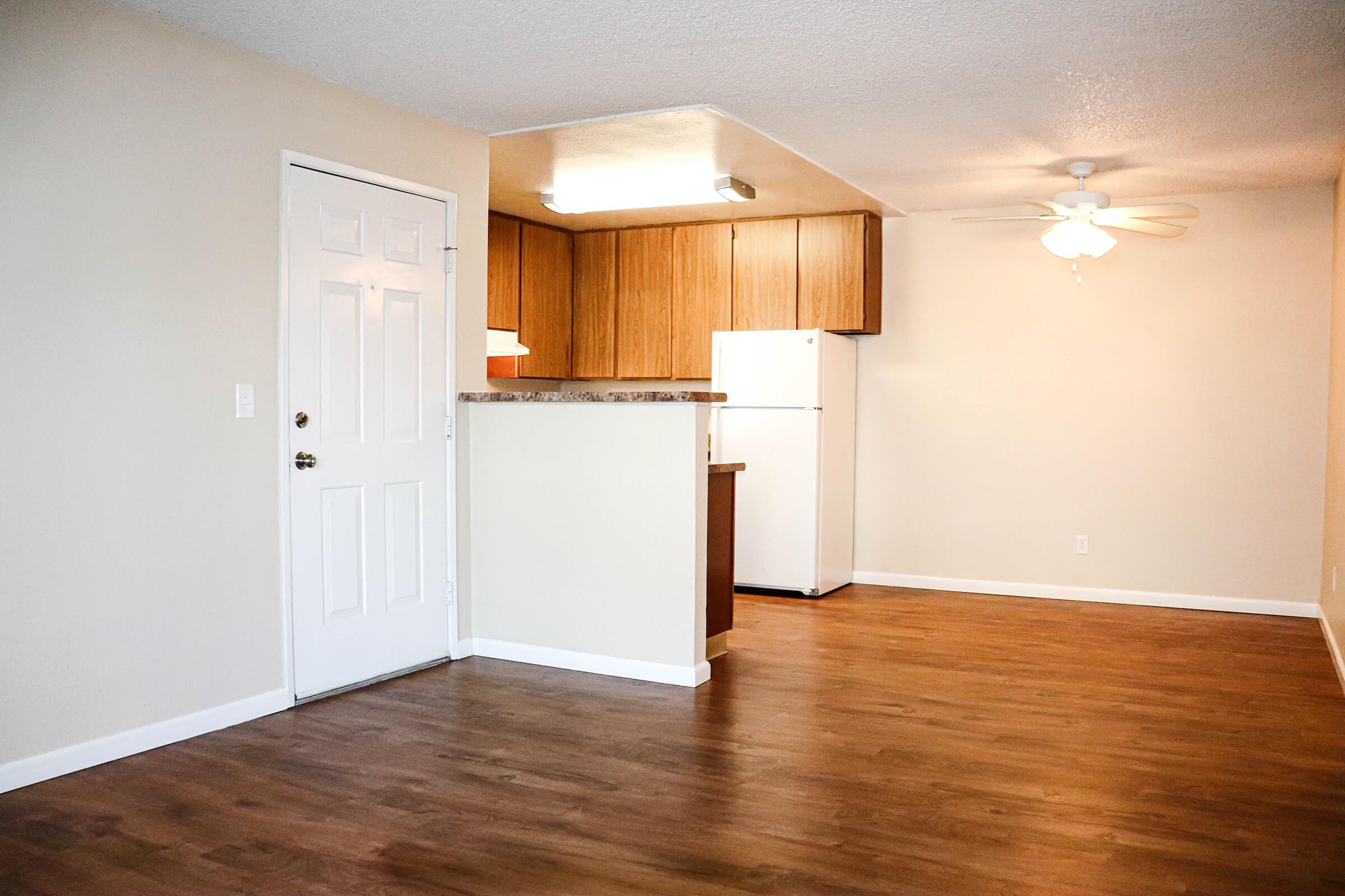 a kitchen with a wood floor