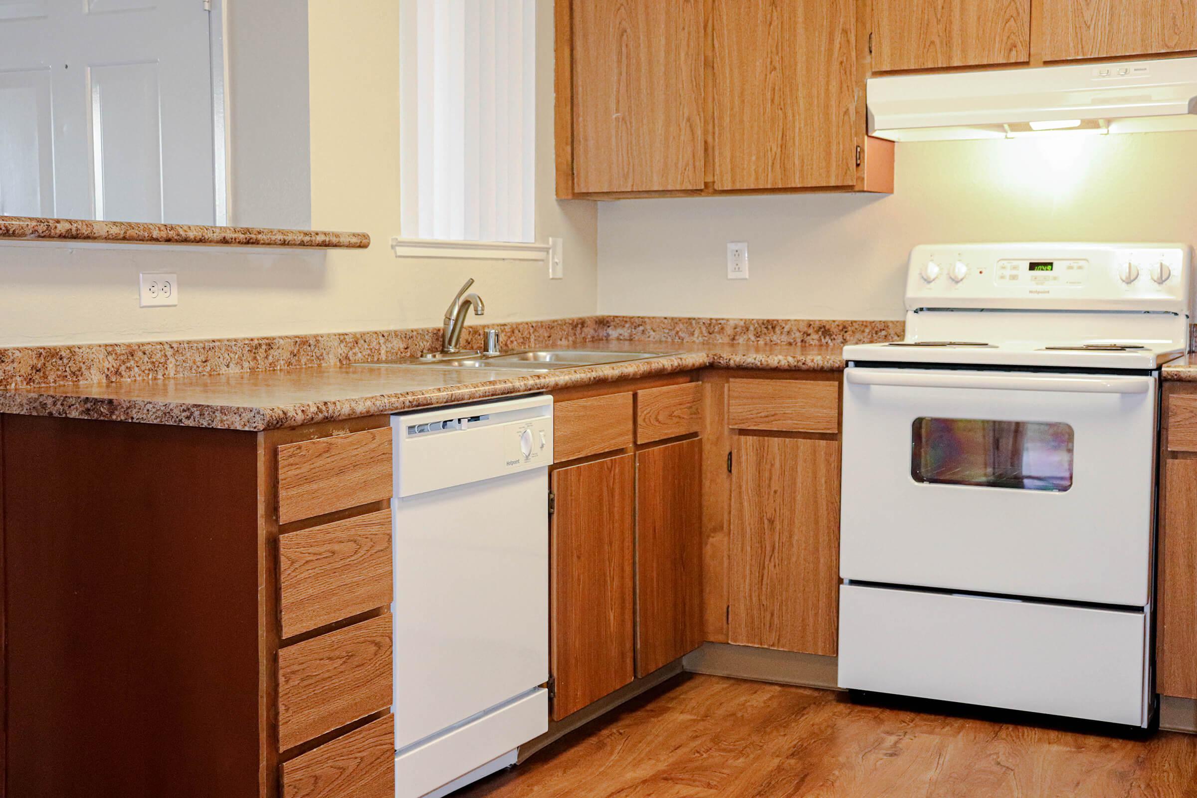 a kitchen with a stove top oven sitting inside of a refrigerator