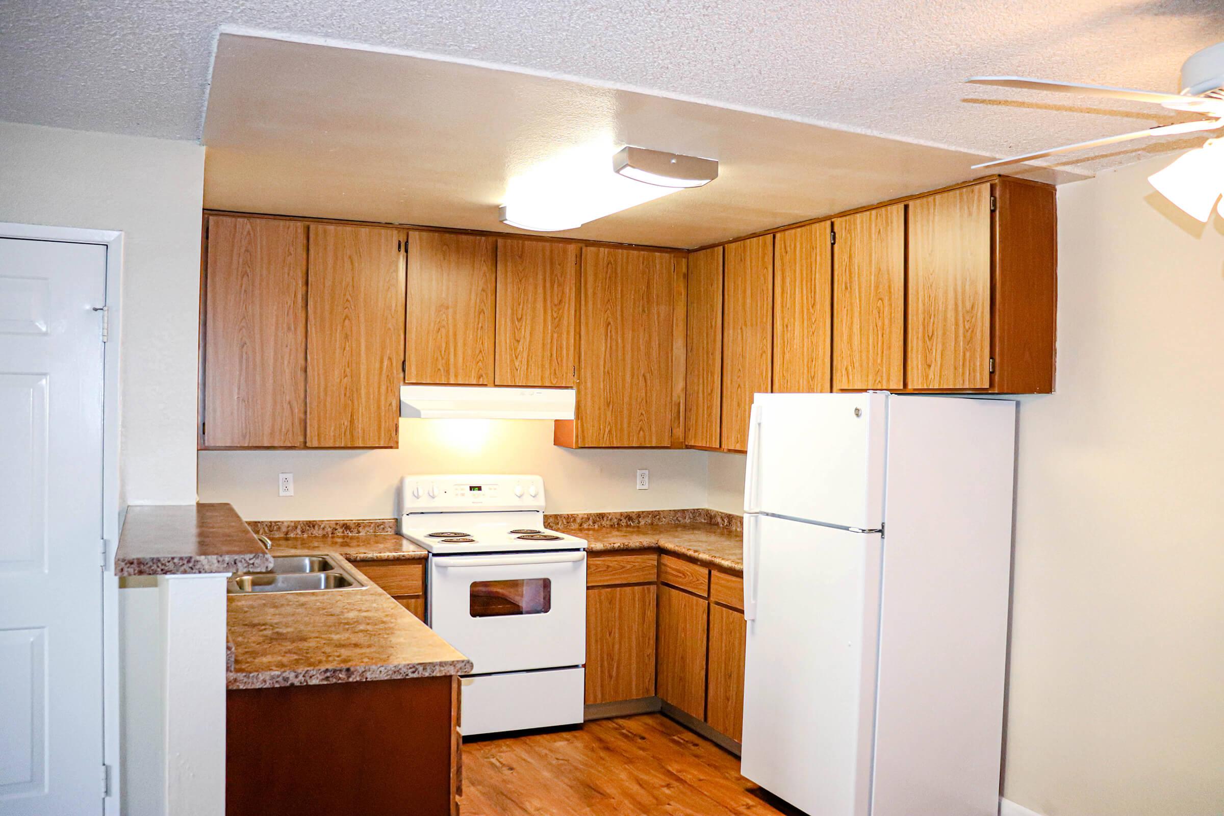 a kitchen with a stove top oven sitting inside of a refrigerator