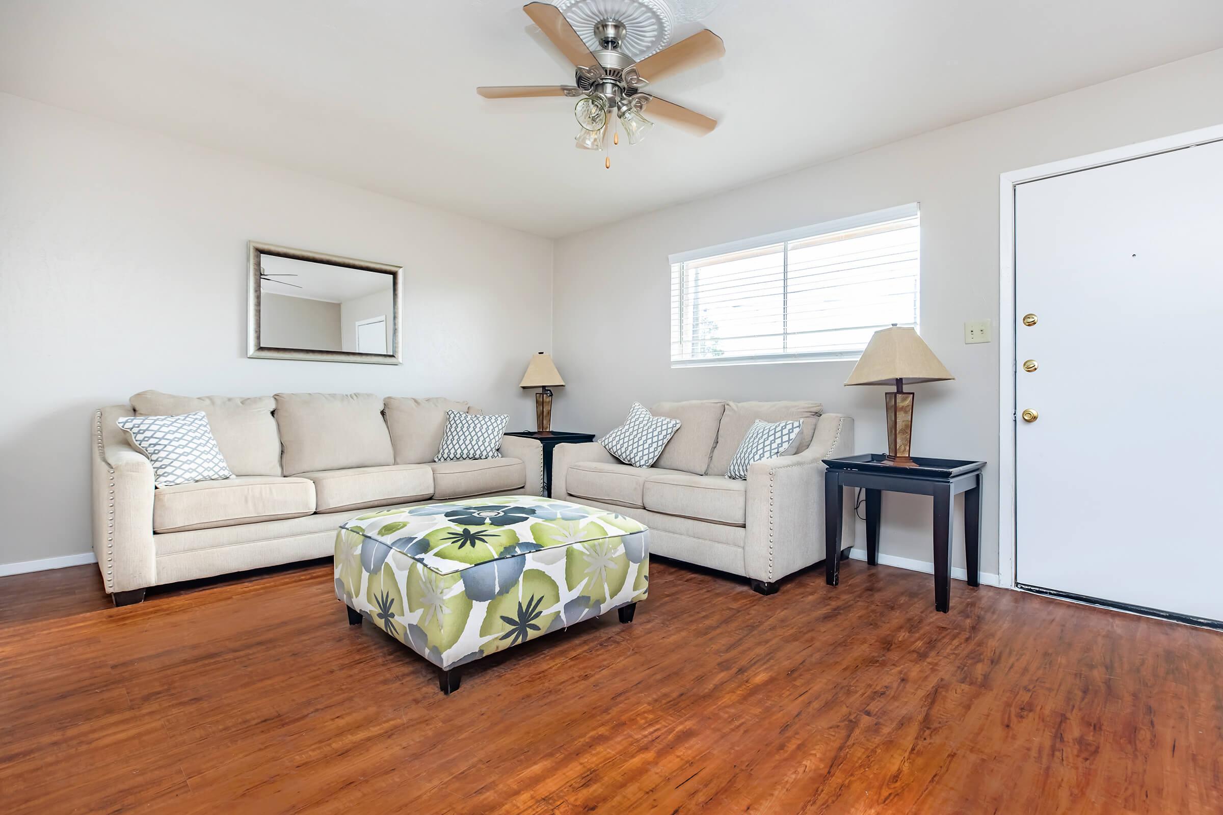 a bedroom with a bed and desk in a room