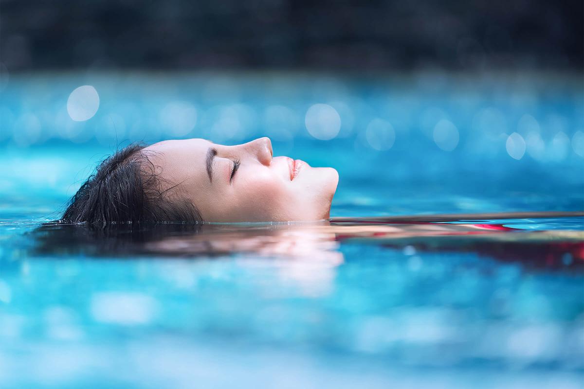 Relaxing in swimming pool iStock-856857146.jpg