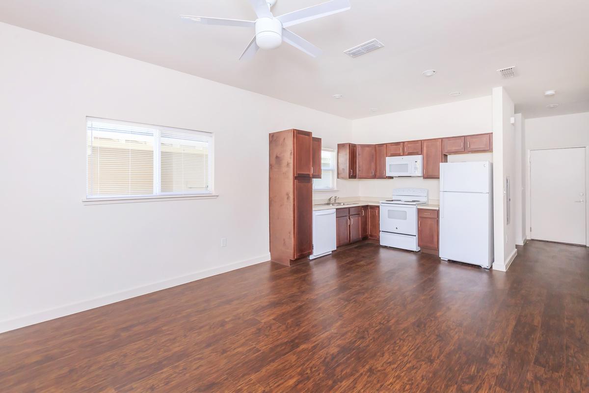 a large empty room with a wood floor