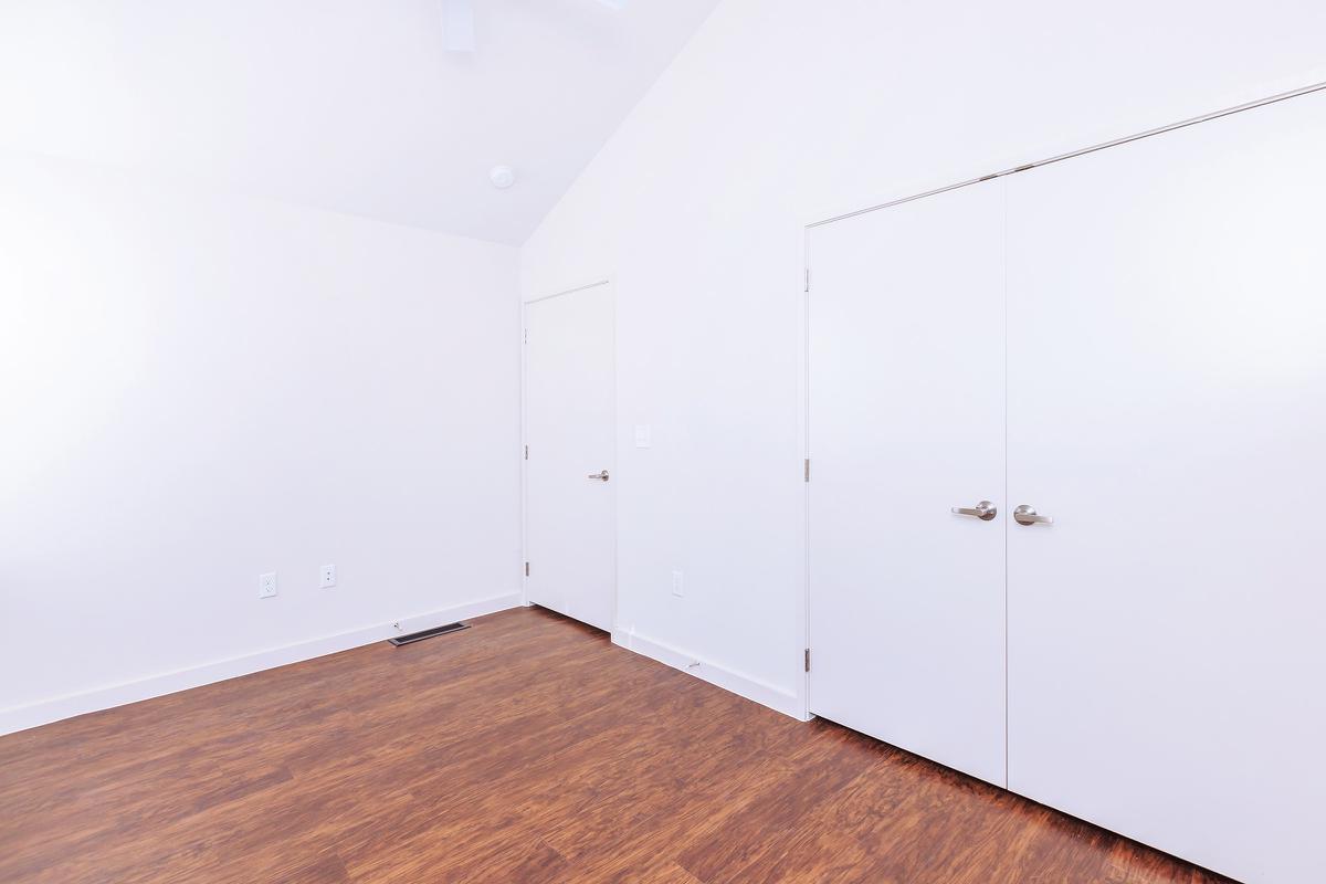 a kitchen with a wooden floor