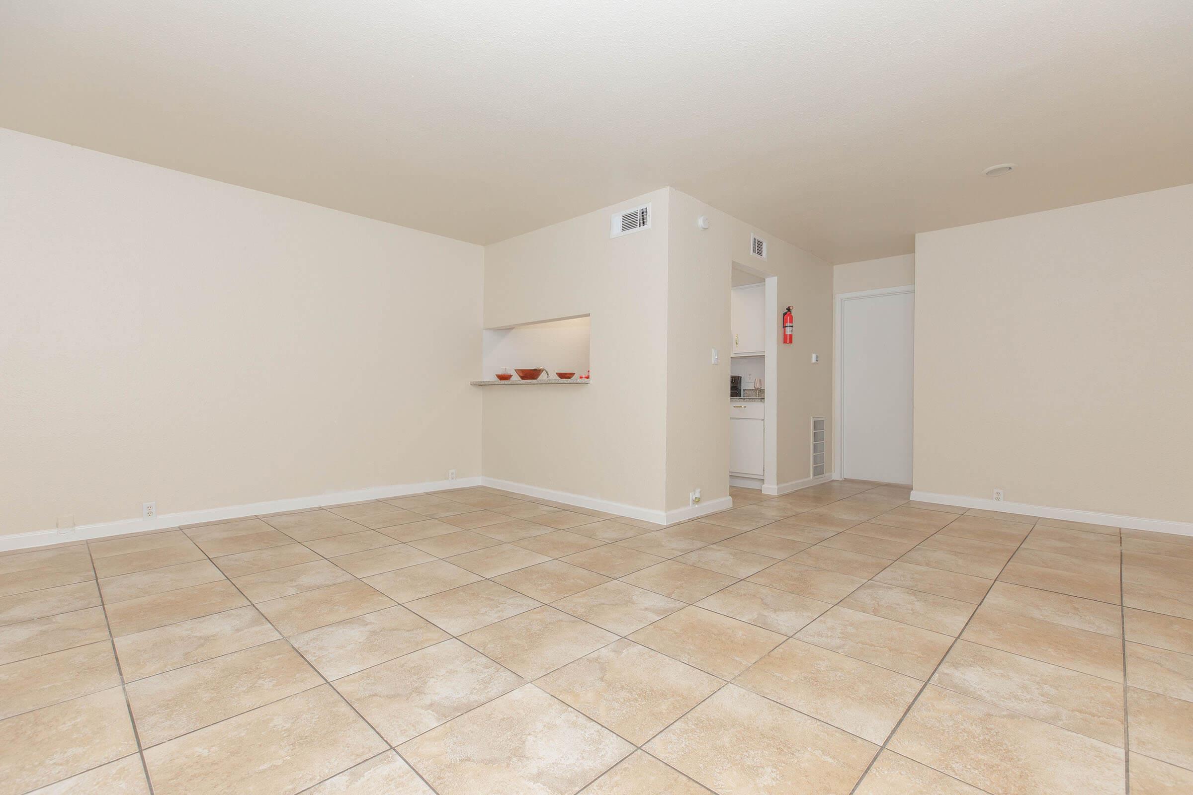 a kitchen with a tile floor