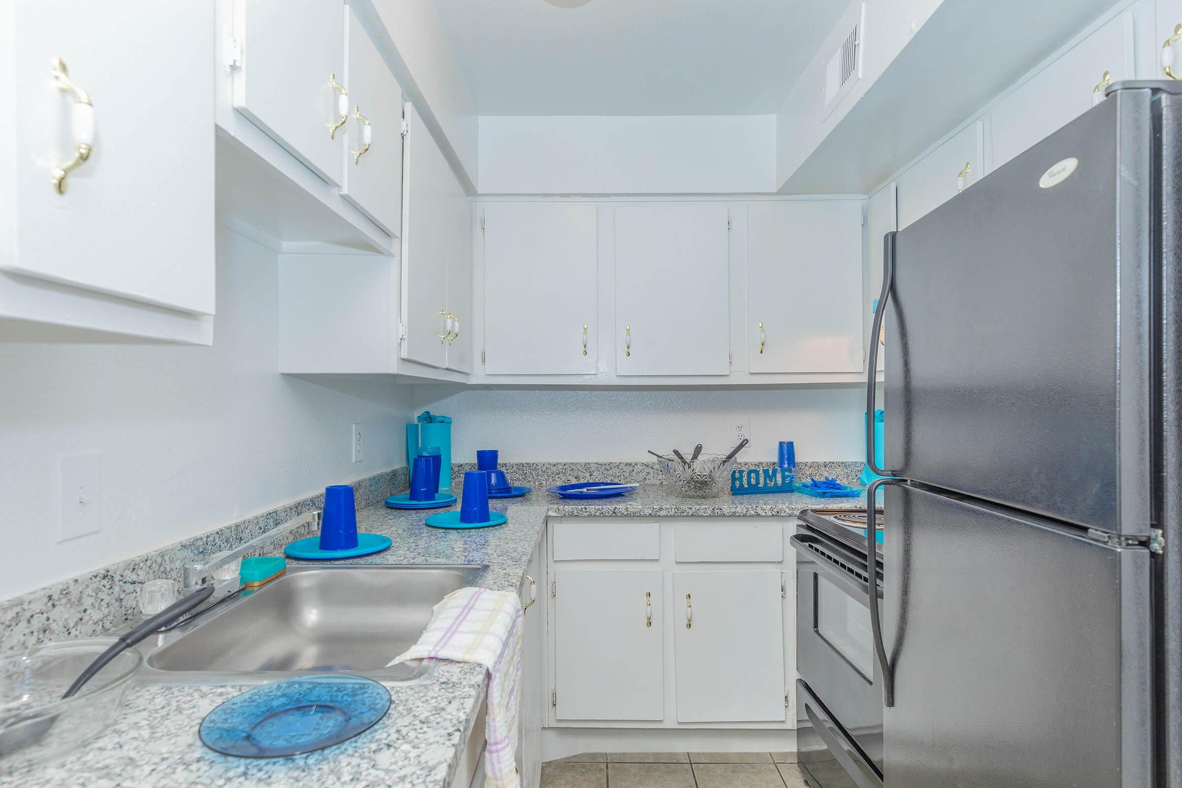 a kitchen with a blue background