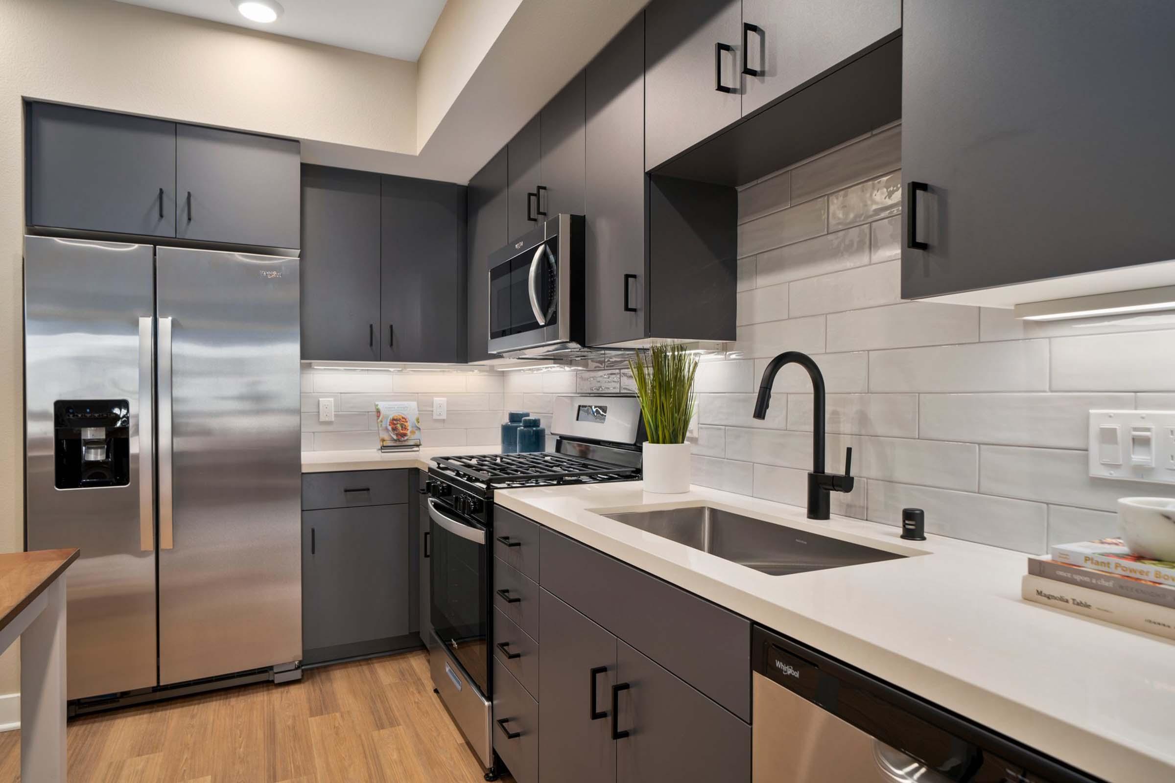 a modern kitchen with stainless steel appliances