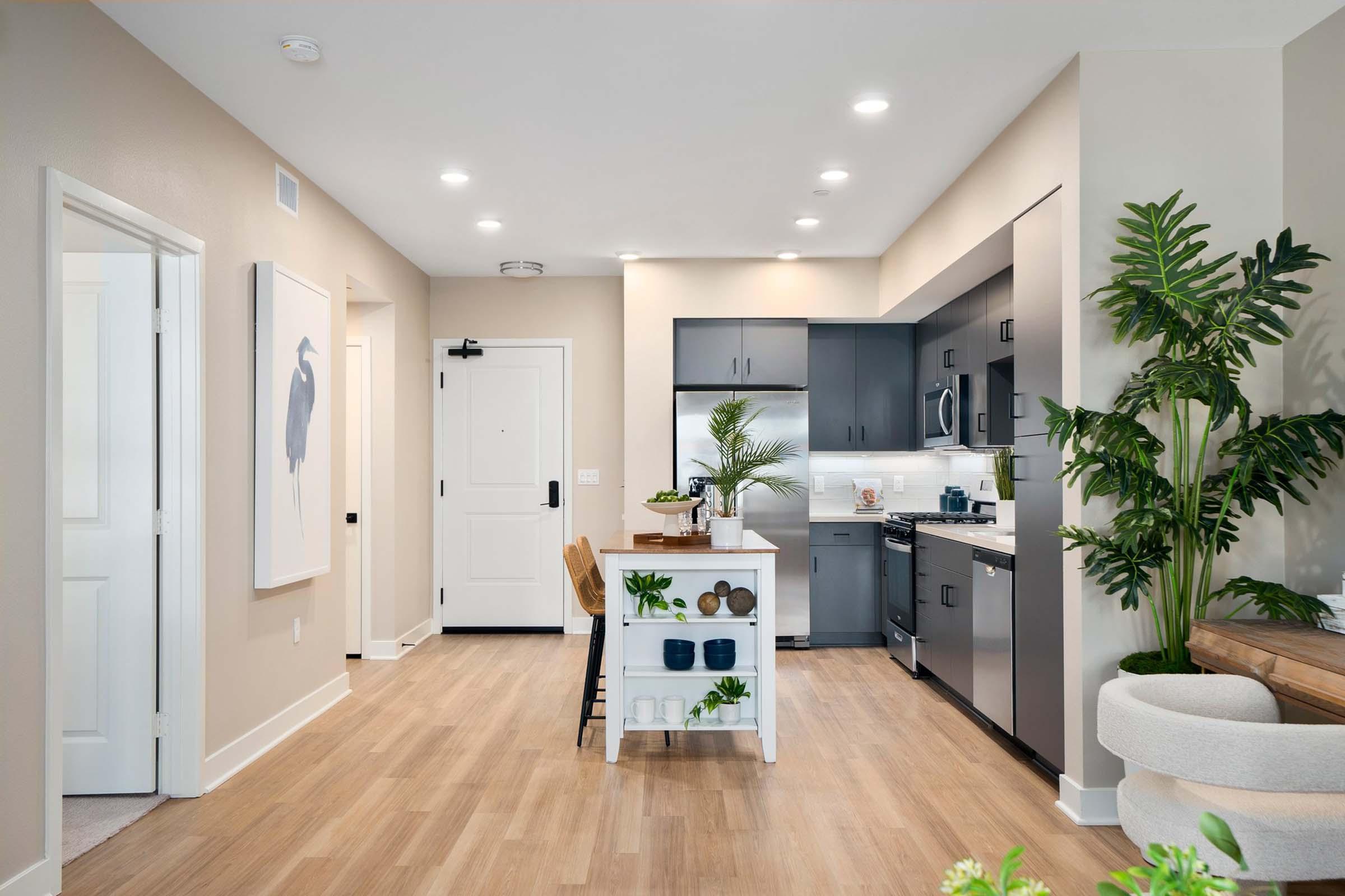 a living room filled with furniture and a sink