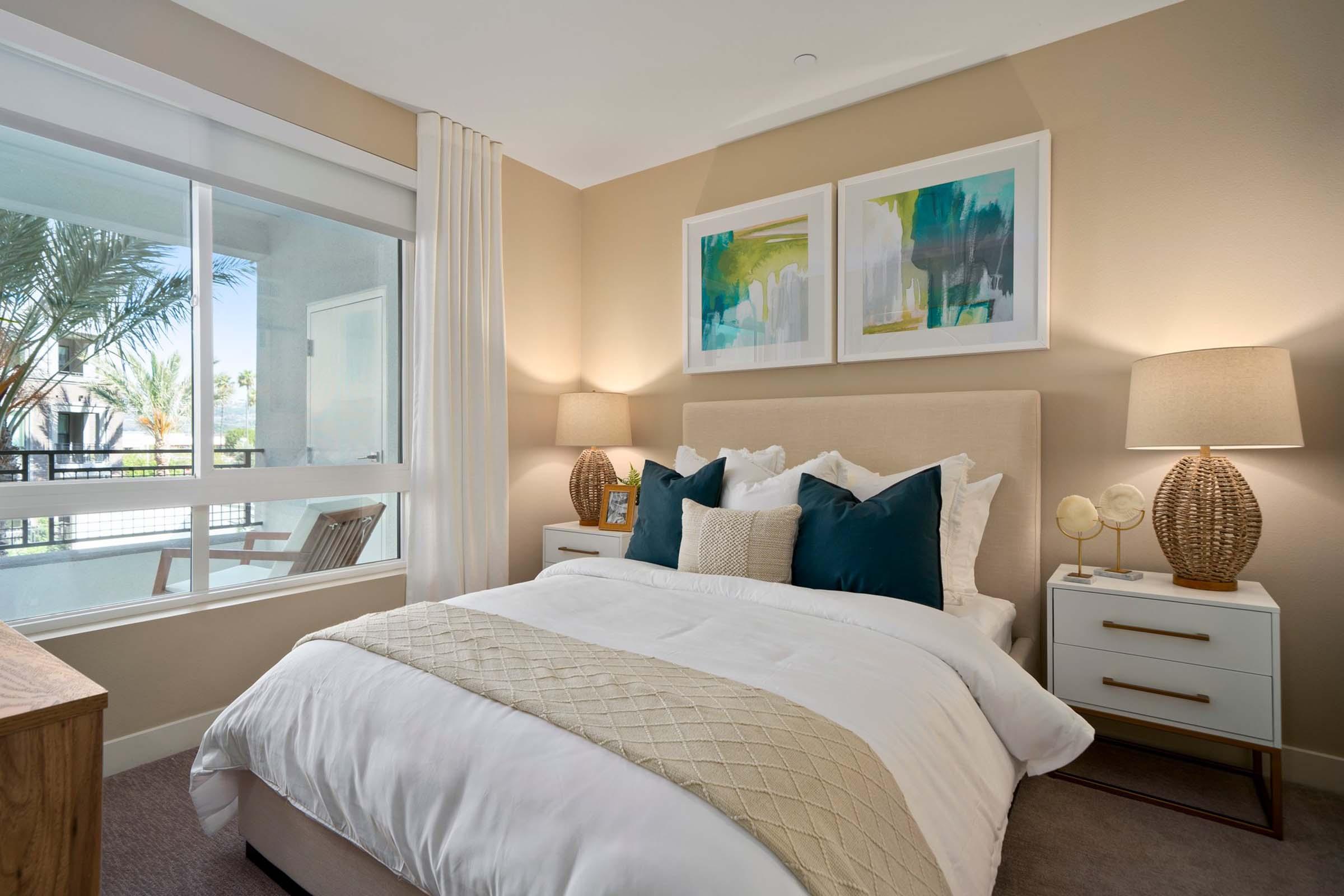 a bedroom with a large bed in a hotel room