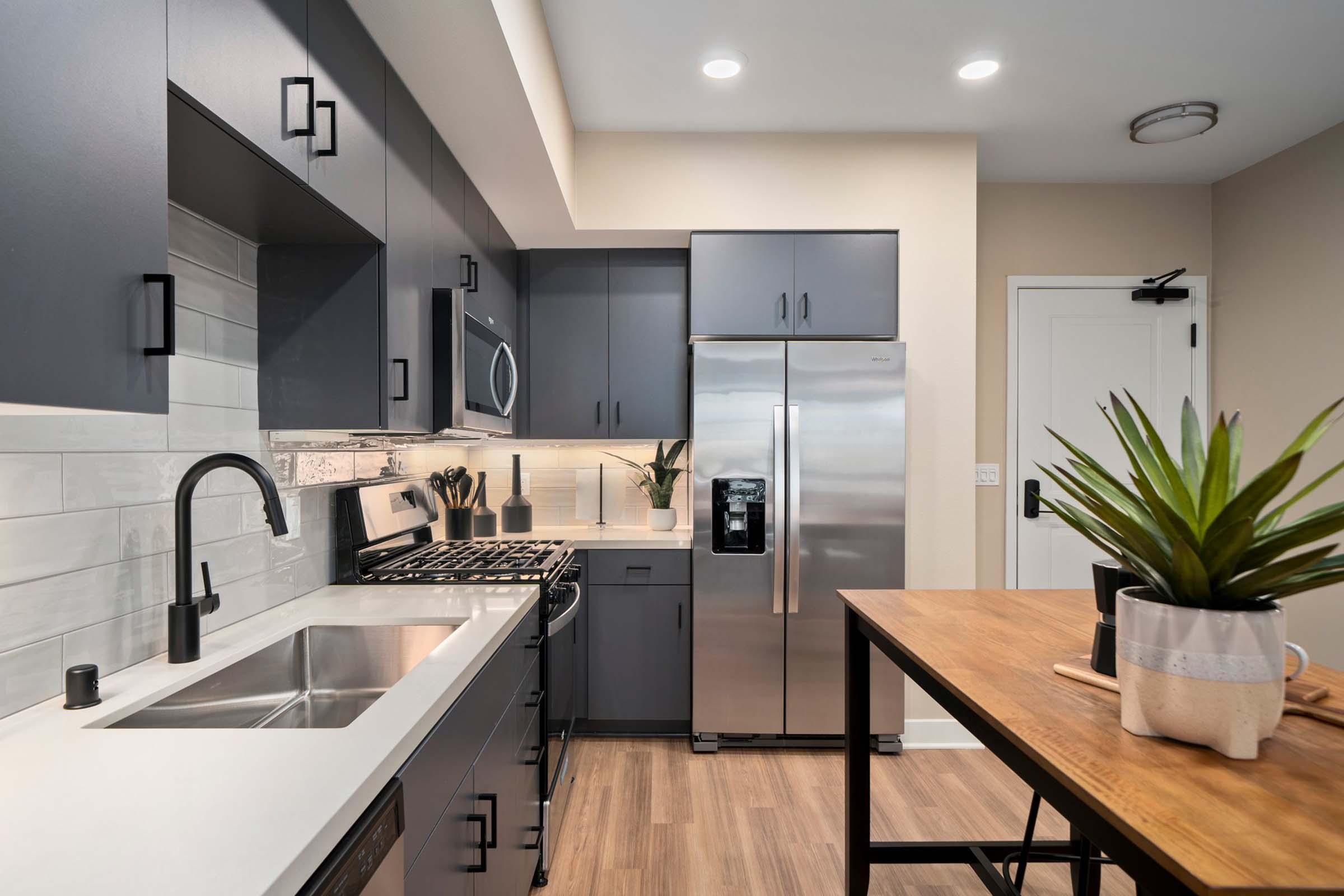 a modern kitchen with stainless steel appliances