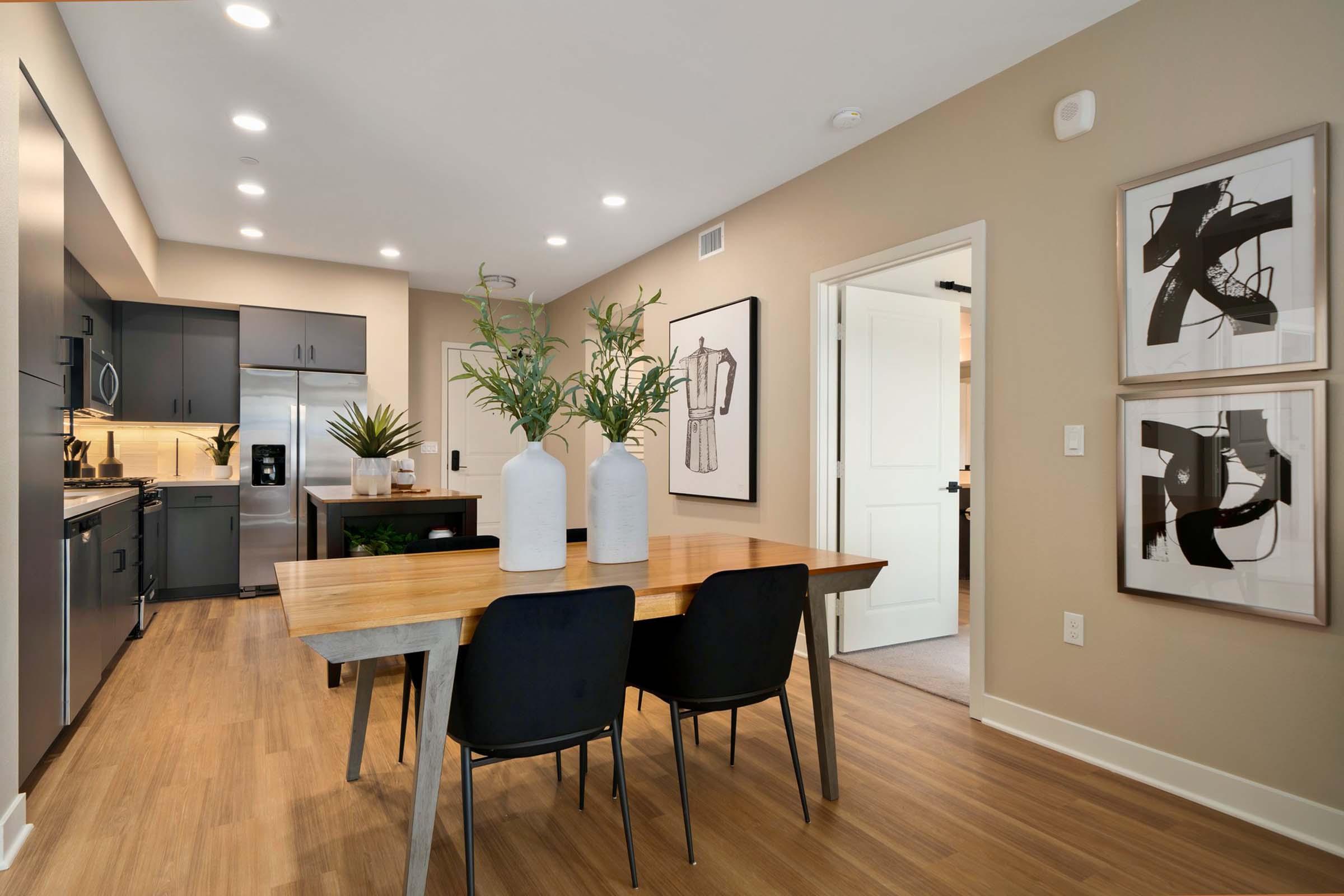 a living room filled with furniture and a large window