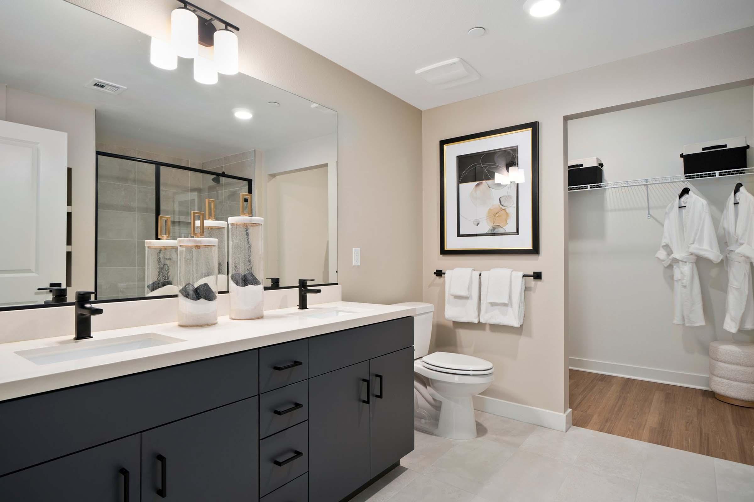 a kitchen with a sink and a mirror