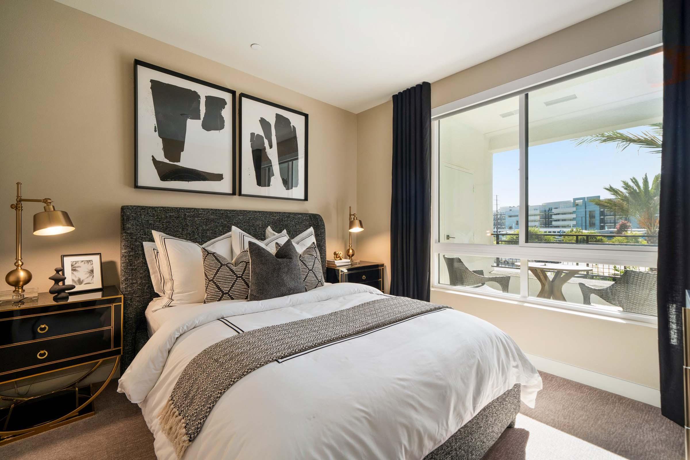 a bedroom with a large bed in a hotel room