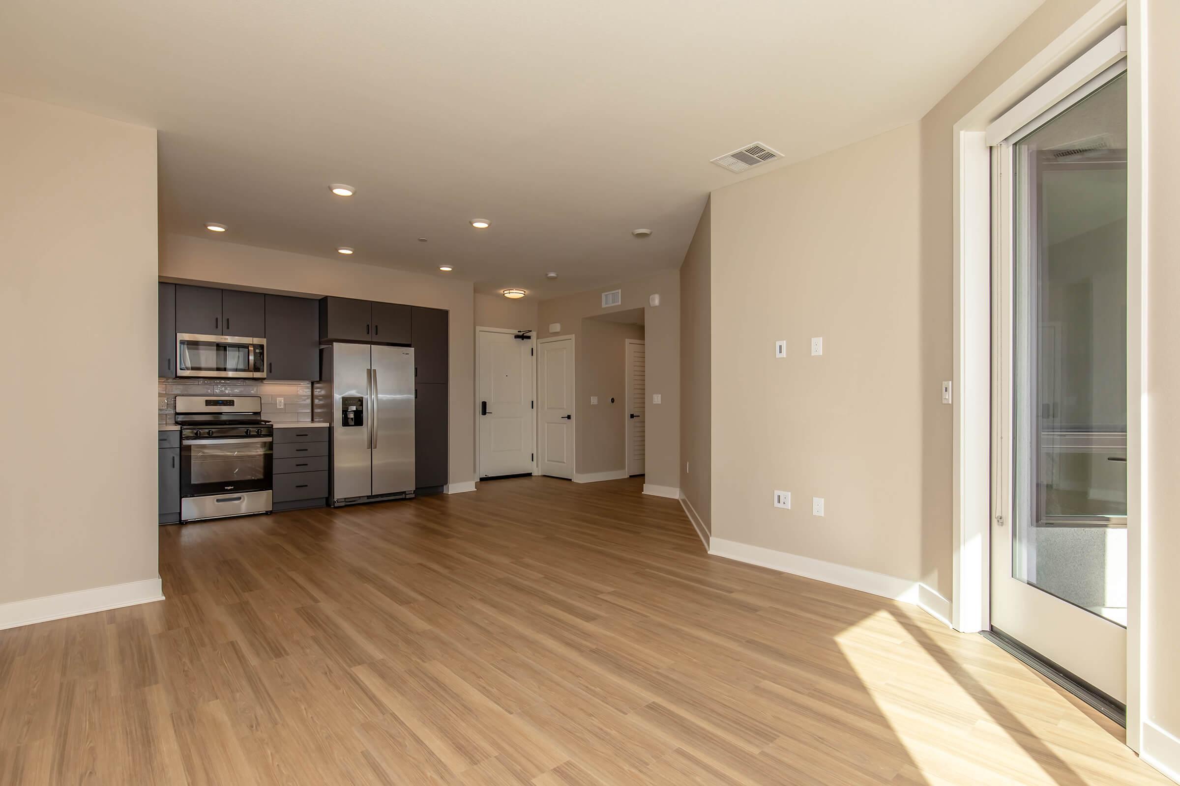 a large empty room with a wood floor