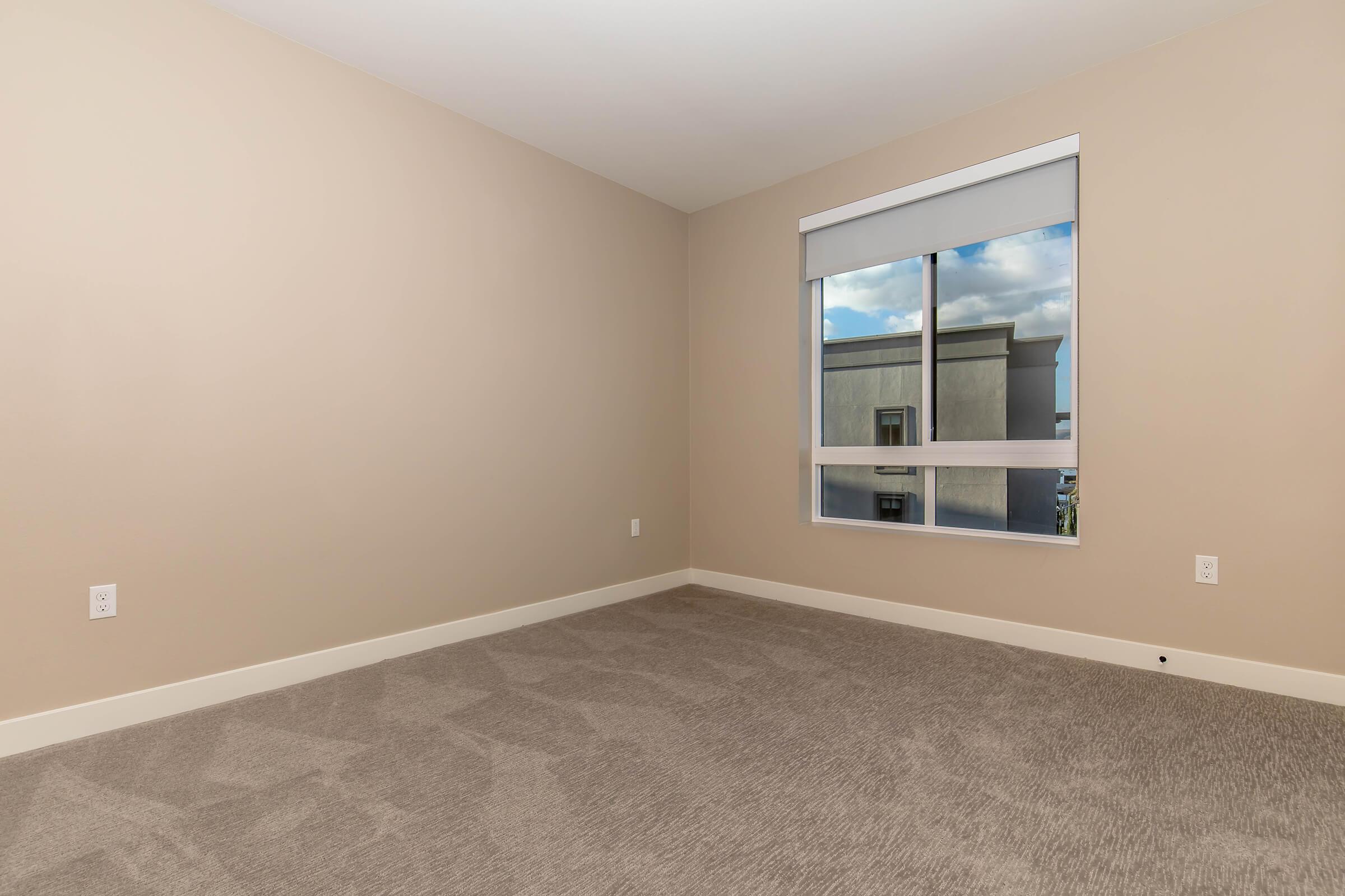 a bedroom with a large mirror