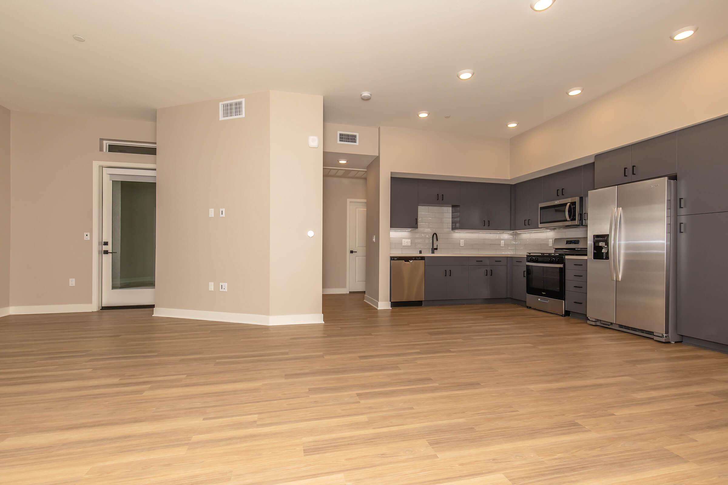 a large kitchen with stainless steel appliances